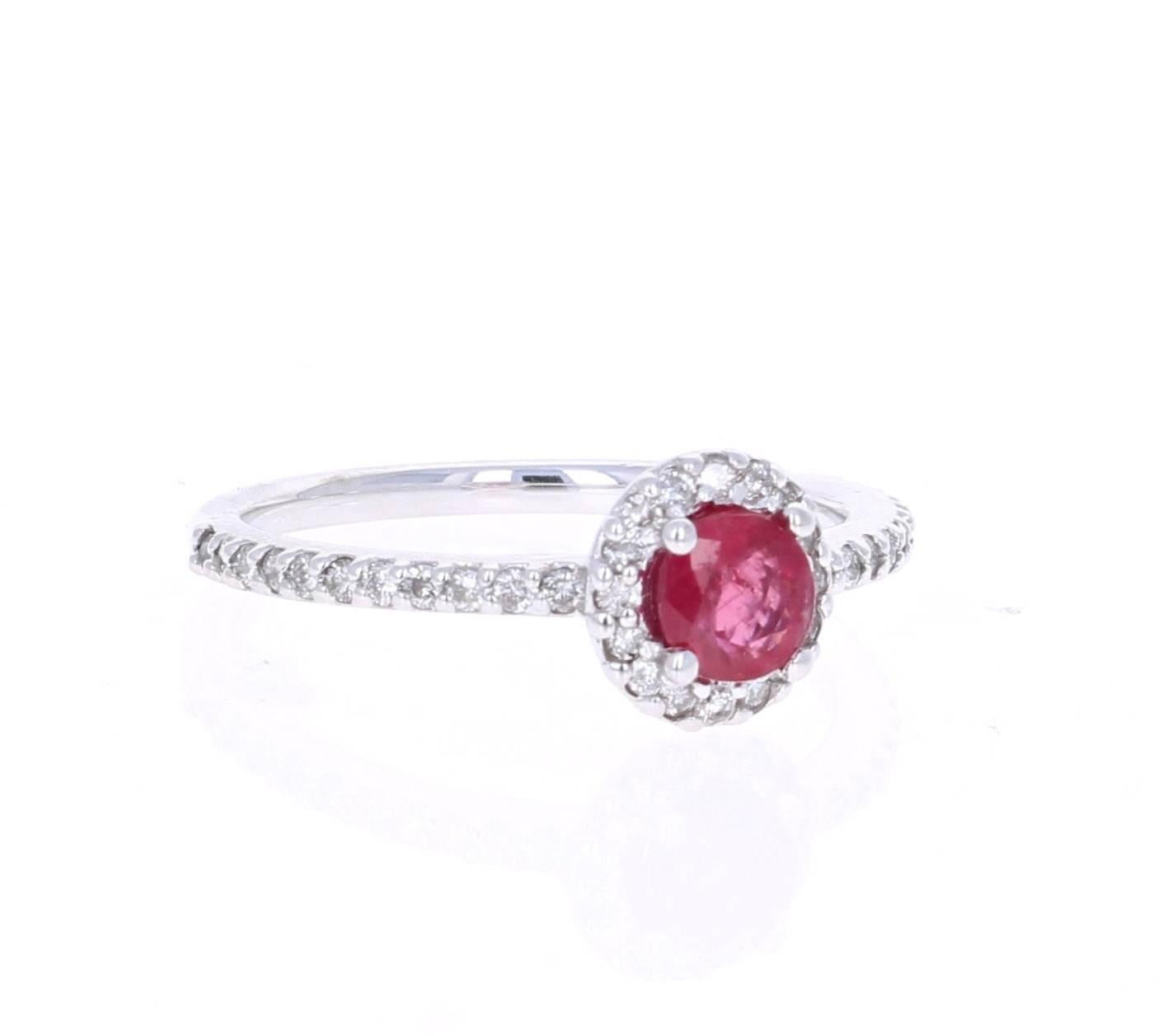 This elegant and dainty Ruby Diamond Ring can be a modern Engagement/Promise ring. It has a Round Cut Ruby that is 0.64 carats with a flow of 38 Round Cut Diamonds weighing 0.35 carats.  The total carat weight of the ring is 0.99 carats. It is set