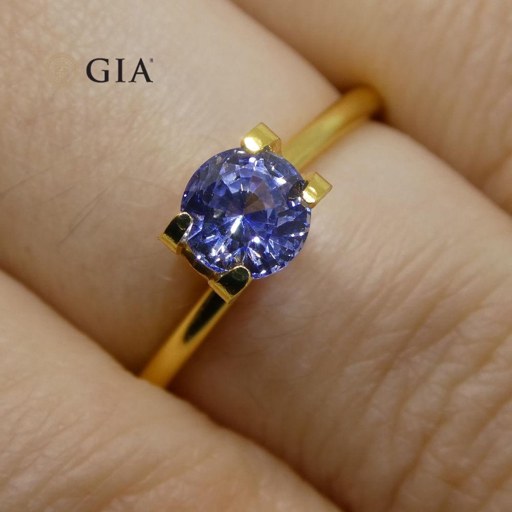 This is a stunning GIA Certified Sapphire

The GIA report reads as follows:

GIA Report Number: 1206853713
Shape: Round
Cutting Style:
Cutting Style: Crown: Brilliant Cut
Cutting Style: Pavilion: Step Cut
Transparency: Transparent
Color: