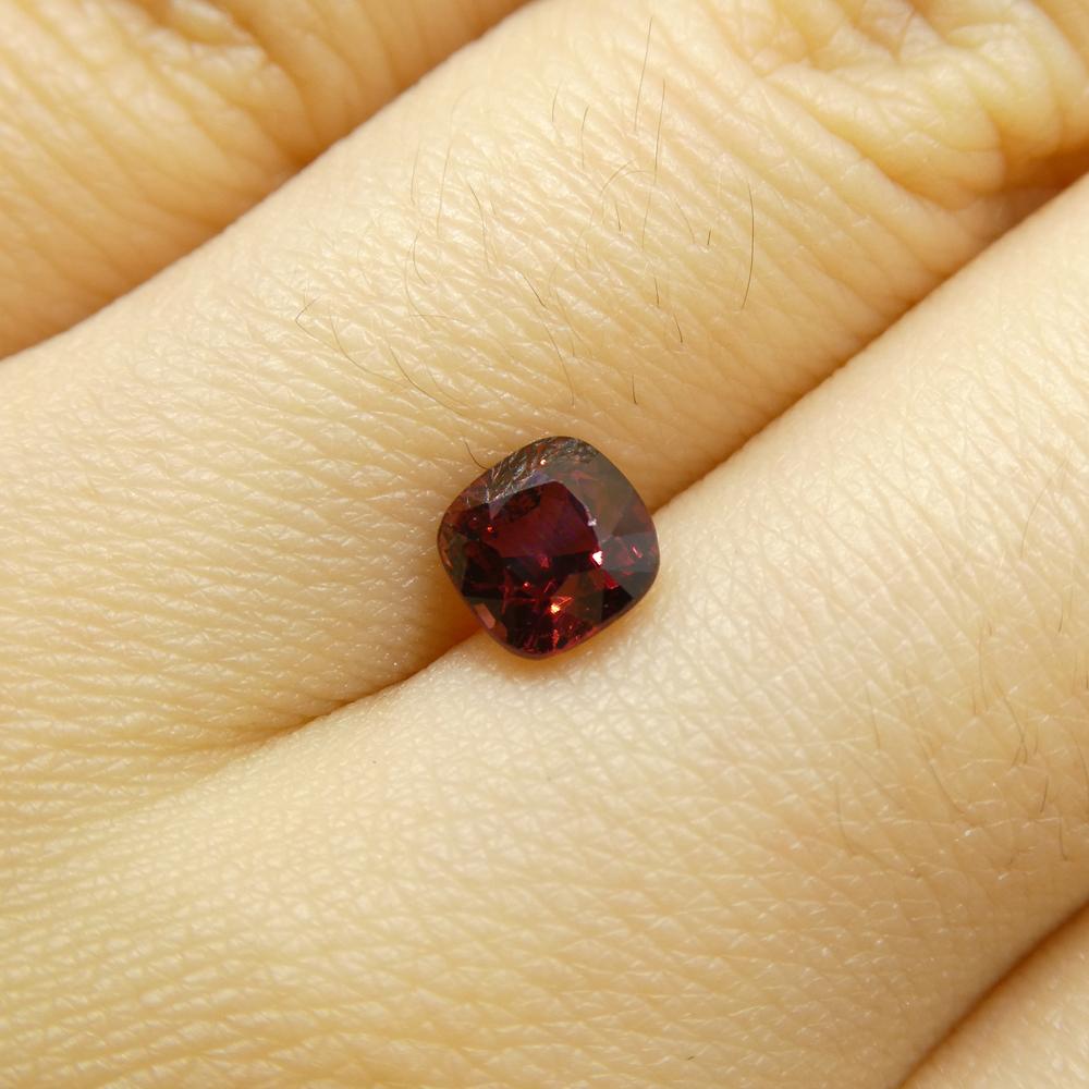 Description:

Gem Type: Jedi Spinel 
Number of Stones: 1
Weight: 0.99 cts
Measurements: 5.21 x 5.13 x 4.32 mm
Shape: Cushion
Cutting Style Crown: Brilliant Cut
Cutting Style Pavilion: Step Cut 
Transparency: Transparent
Clarity: Very Slightly