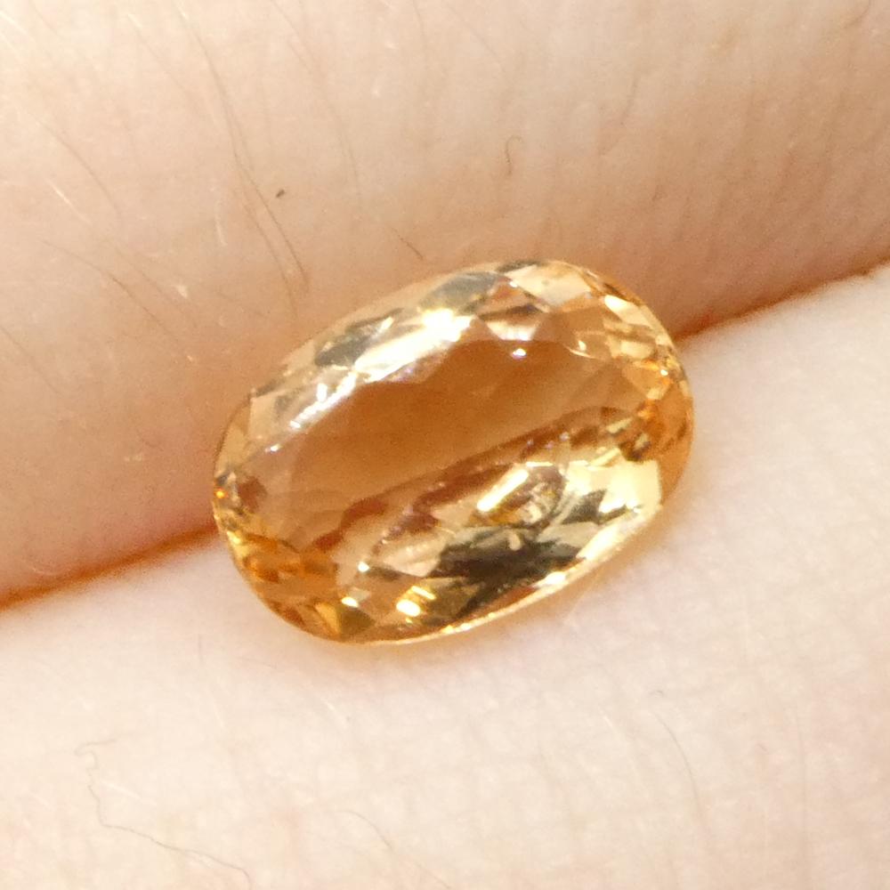 0,99ct Topacio imperial naranja ovalado de Brasil sin calentar en venta 8
