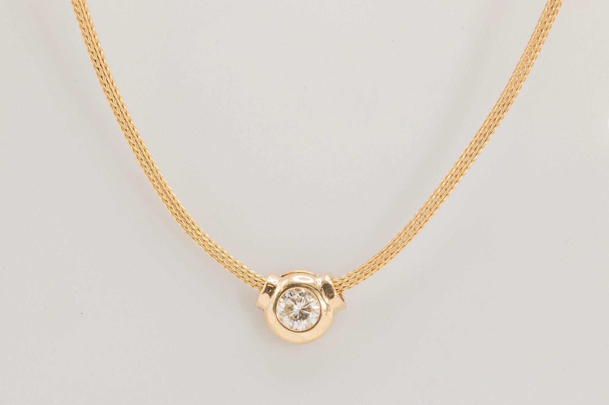 This special piece puts the spotlight on one 0.99ct round brilliant-cut diamond, graded I in color and I1 in clarity, set in a lightweight faux bezel pendant that slides seamlessly along an intricately woven 17