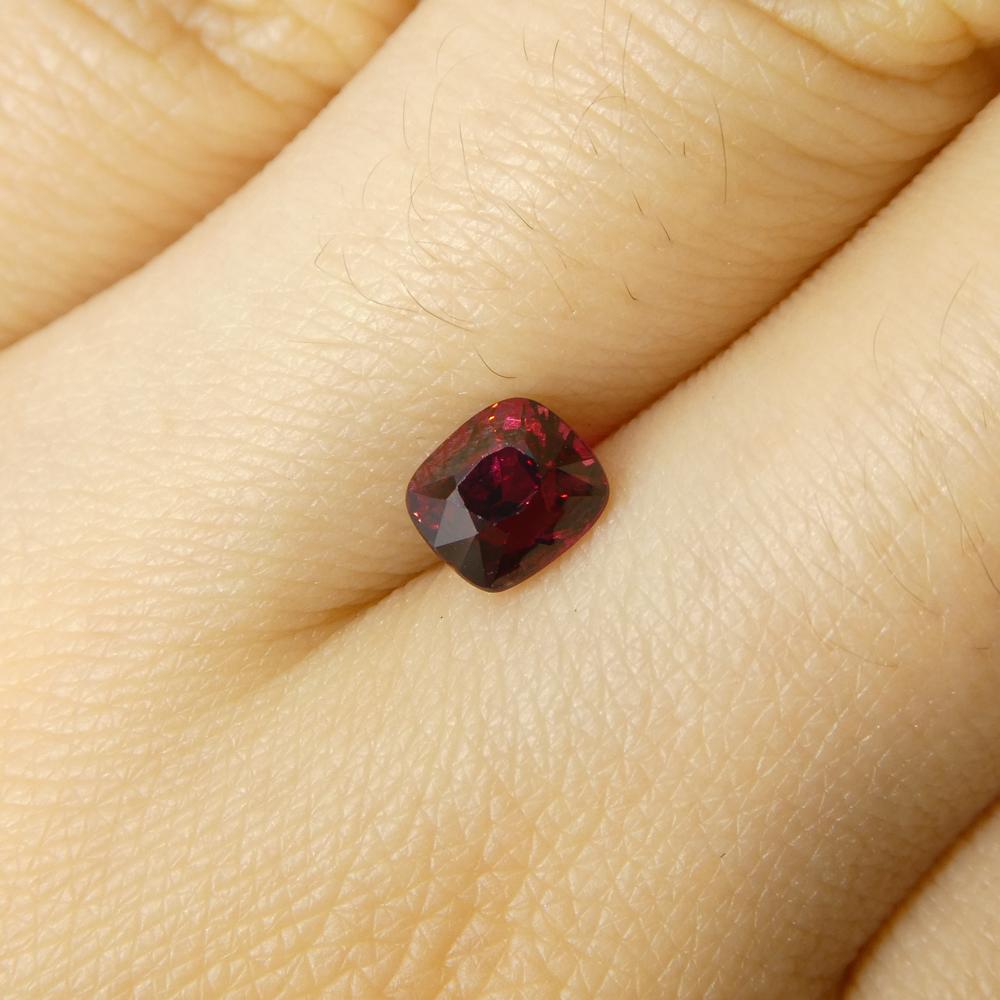 Description:

Gem Type: Jedi Spinel 
Number of Stones: 1
Weight: 0.9 cts
Measurements: 5.34 x 4.73 x 4.34  mm
Shape: Cushion
Cutting Style Crown: Brilliant Cut
Cutting Style Pavilion: Step Cut 
Transparency: Transparent
Clarity: Slightly Included: