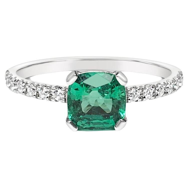 0.9 Ct Emerald and Diamonds Ring