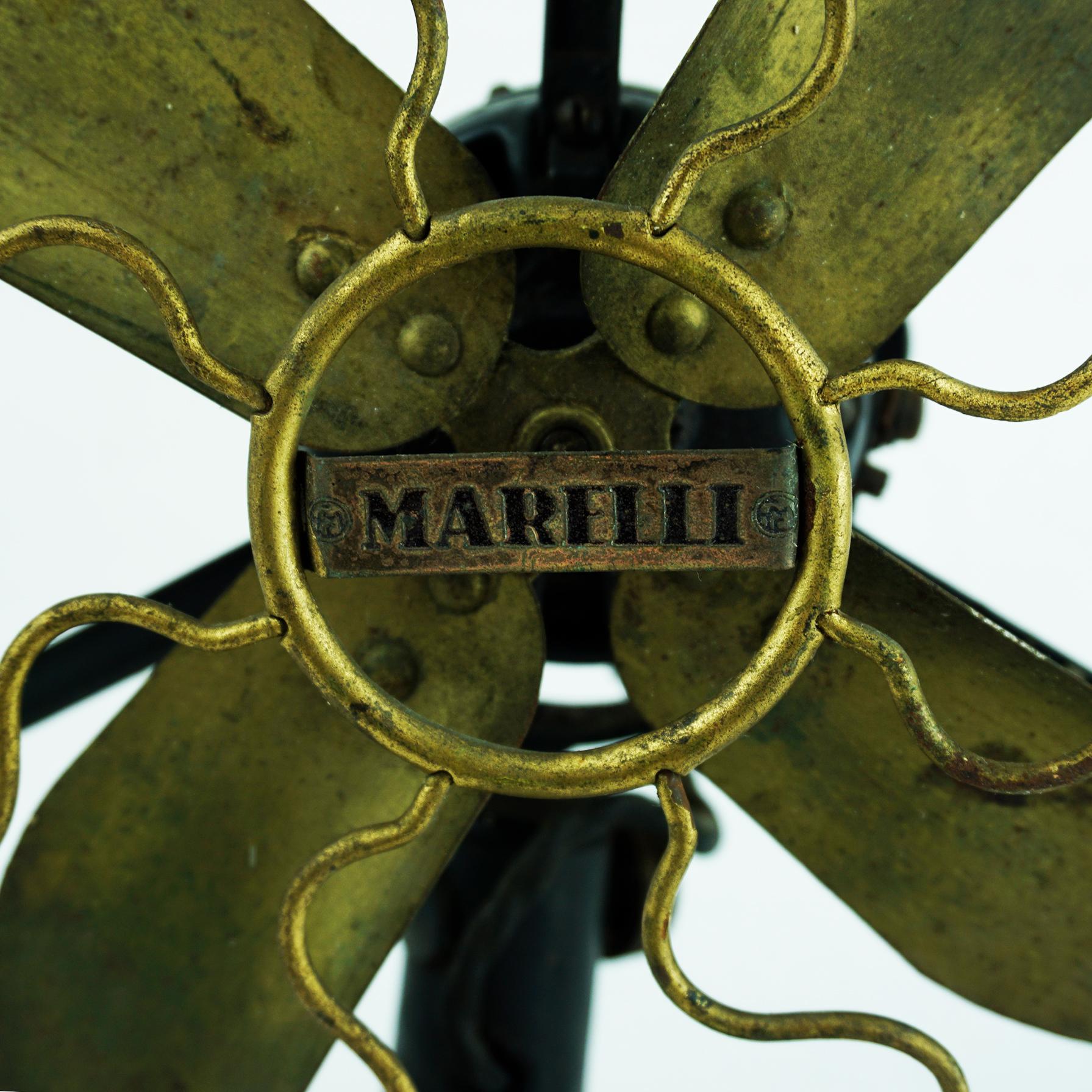 This iconoc Italian table fan has been produced by Marelli ca 1940s.
It is in original condition, with some wear and some losses at the base consistent of age and use, preserving a beautiful patina. Please have a look at the photos! It still is