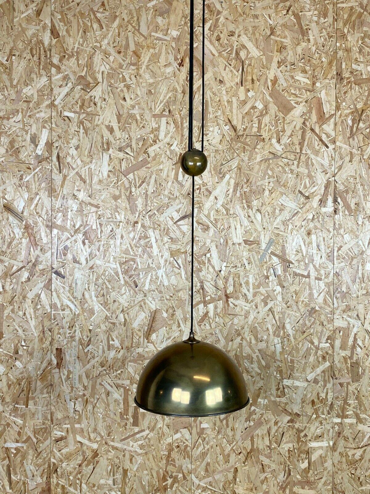 0s lamp ceiling lamp Florian Schulz Posa brass Brass Pendant Lamp 70s

Object: ceiling lamp

Manufacturer: Florian Schulz

Condition: good

Age: around 1960-1970

Dimensions:

Diameter = 38cm
Height = variable

Other notes:

The