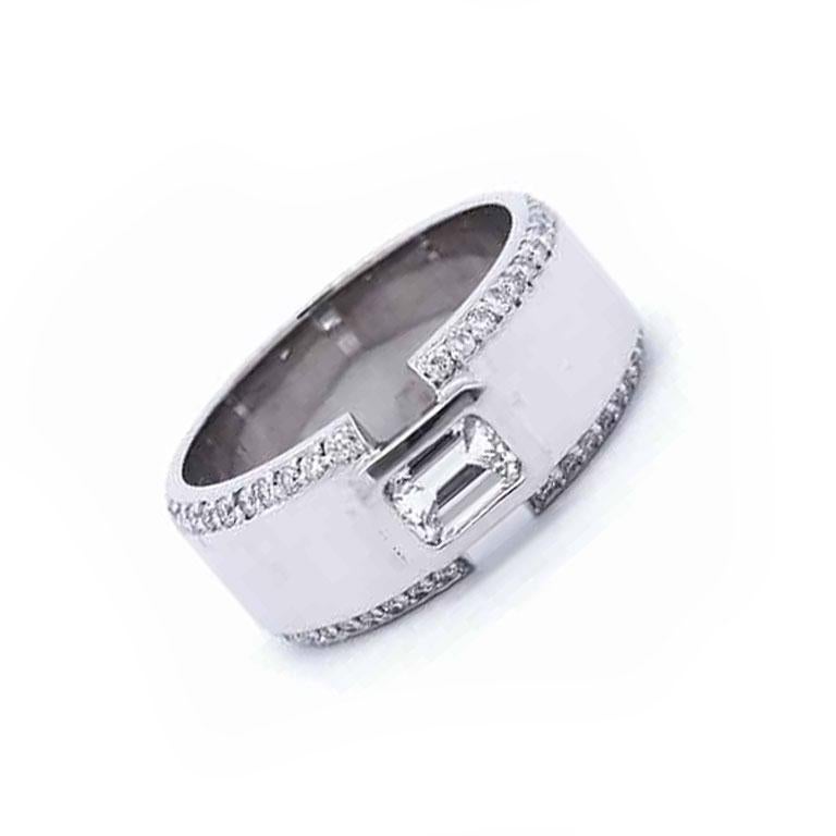This 1 1/2 Carat Designer Diamond Gents Ring in 14K White Gold is the perfect blend of sophistication and bold style. Featuring a striking .64 carat emerald cut center diamond, this ring captures attention with its clean lines and timeless appeal.