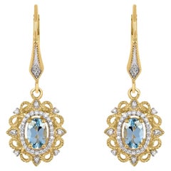 1-1/20 ct. Boucles d'oreilles pendantes en or jaune 14K serties d'aigue-marine et de diamants