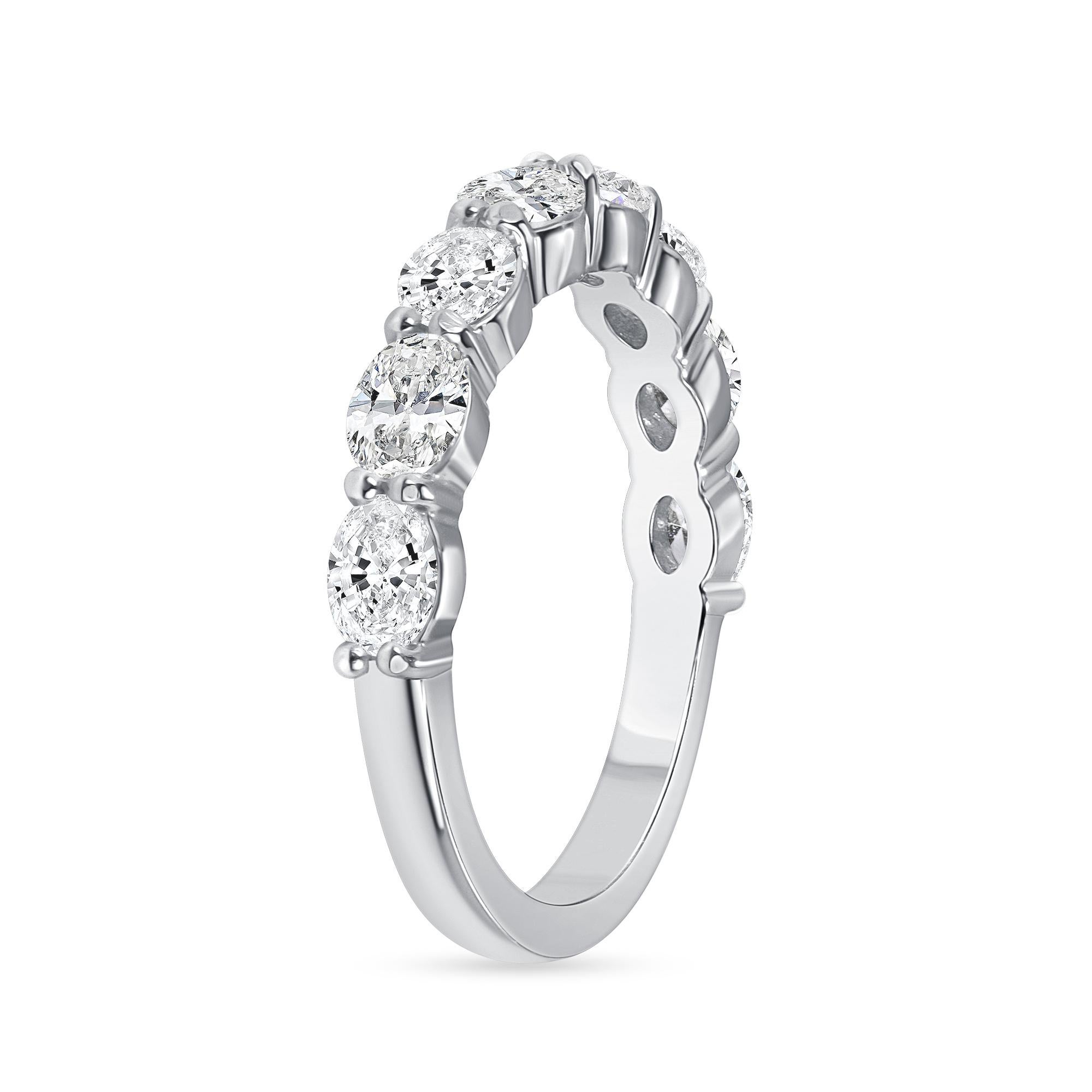 Oval Cut Diamond Half Eternity Band set in Platinum. This half eternity band has eight Oval diamonds in G color, VS clarity, weighing an approximately 1 1/3 carat in total.
