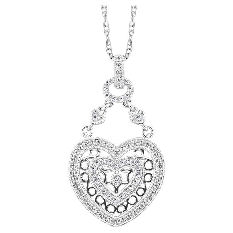 This exquisite pendant necklace features heart within heart pendant accented by share prong set white diamond linked with two split mini hearts to oval belchers. Indulge in the exquisite elegance of our heart within heart pendant necklace in