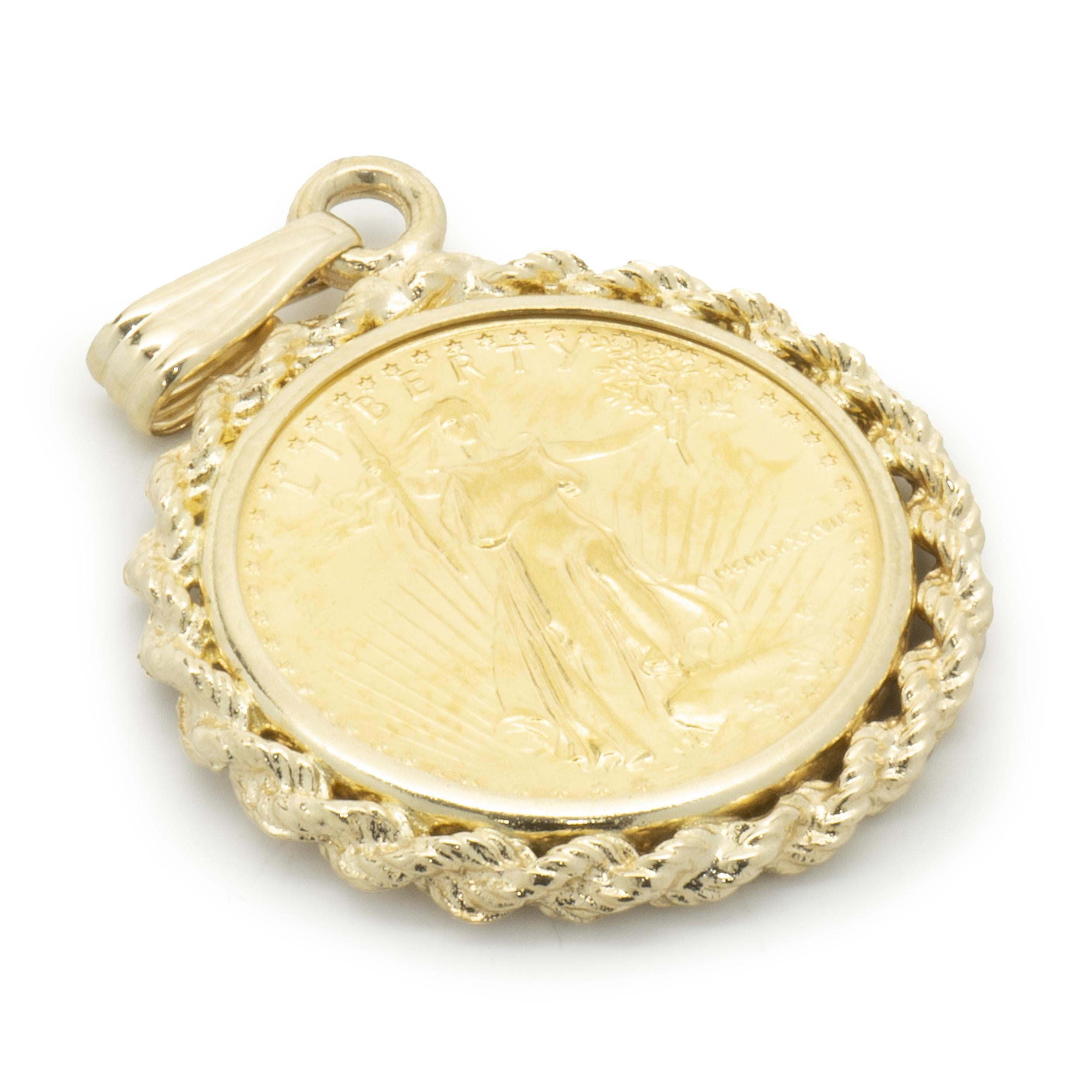 Designer: custom
Material: 14K yellow gold / liberty coin
Dimensions: pendant measures 31 x 21mm 
Weight: 5.15 grams