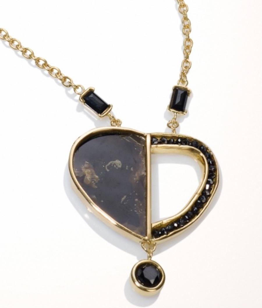 18KY gold handmade 1/2 Black Heart Necklace is a truly a-one-of a-kind necklace. Black Diamonds out line  the open part of the heart, while a solid piece of Black Mica fills in the other half of the Black Heart.
The 1/2 Black Heart Necklace was