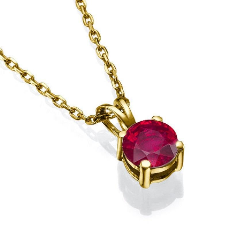 A classic solitaire Ruby pendant necklace made of 14K Yellow Gold set with a Round cut Ruby of 0.50 carat. 
 The center stone of this handmade pendant necklace is of excellent cut, and Red color. The total carat weight of this Ruby pendant is 0.50