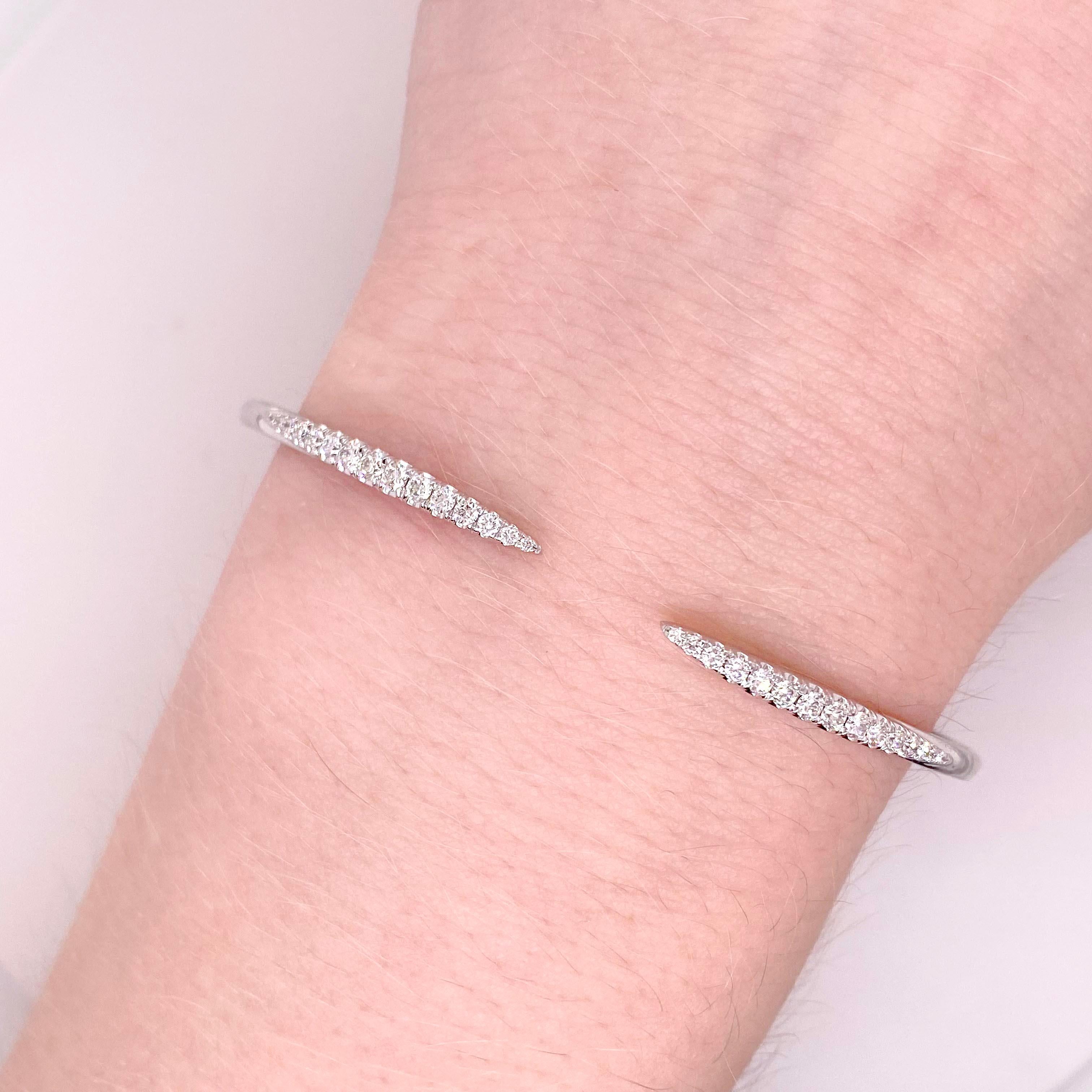Modern diamond bracelet! This diamond bangle bracelet has spiked tips with have pave diamonds set across the tops. The bracelet is flexible, comfortable and easy to put on! With bright white diamonds set in bright white gold. This bangle bracelet