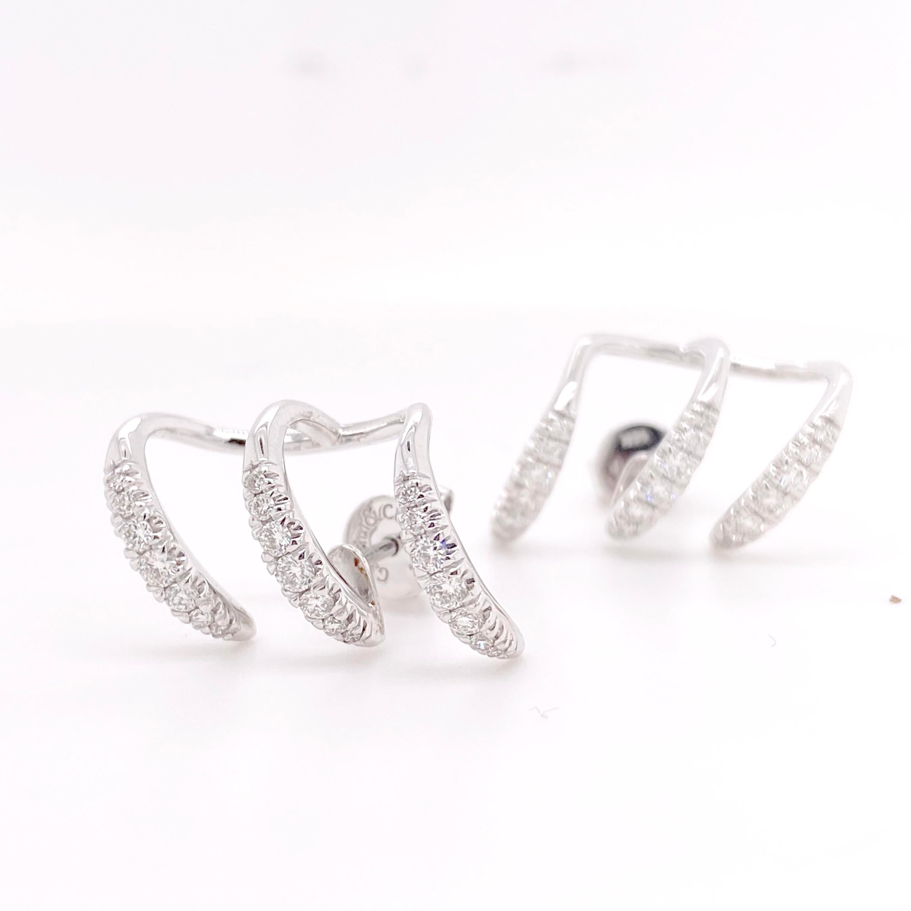 Unique diamond earrings with bright white, sparkly natural diamonds! These earrings have a fun and dynamic design that gives you a custom multi-piercing 