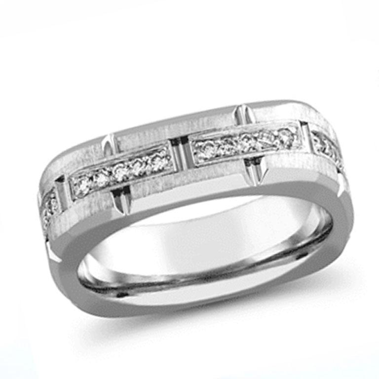 This bold and luxurious gent’s ring features an impressive total diamond weight of 5.4 carats, making it a true statement piece for any occasion. Expertly crafted in 14K white gold, the ring showcases round cut diamonds meticulously prong set all