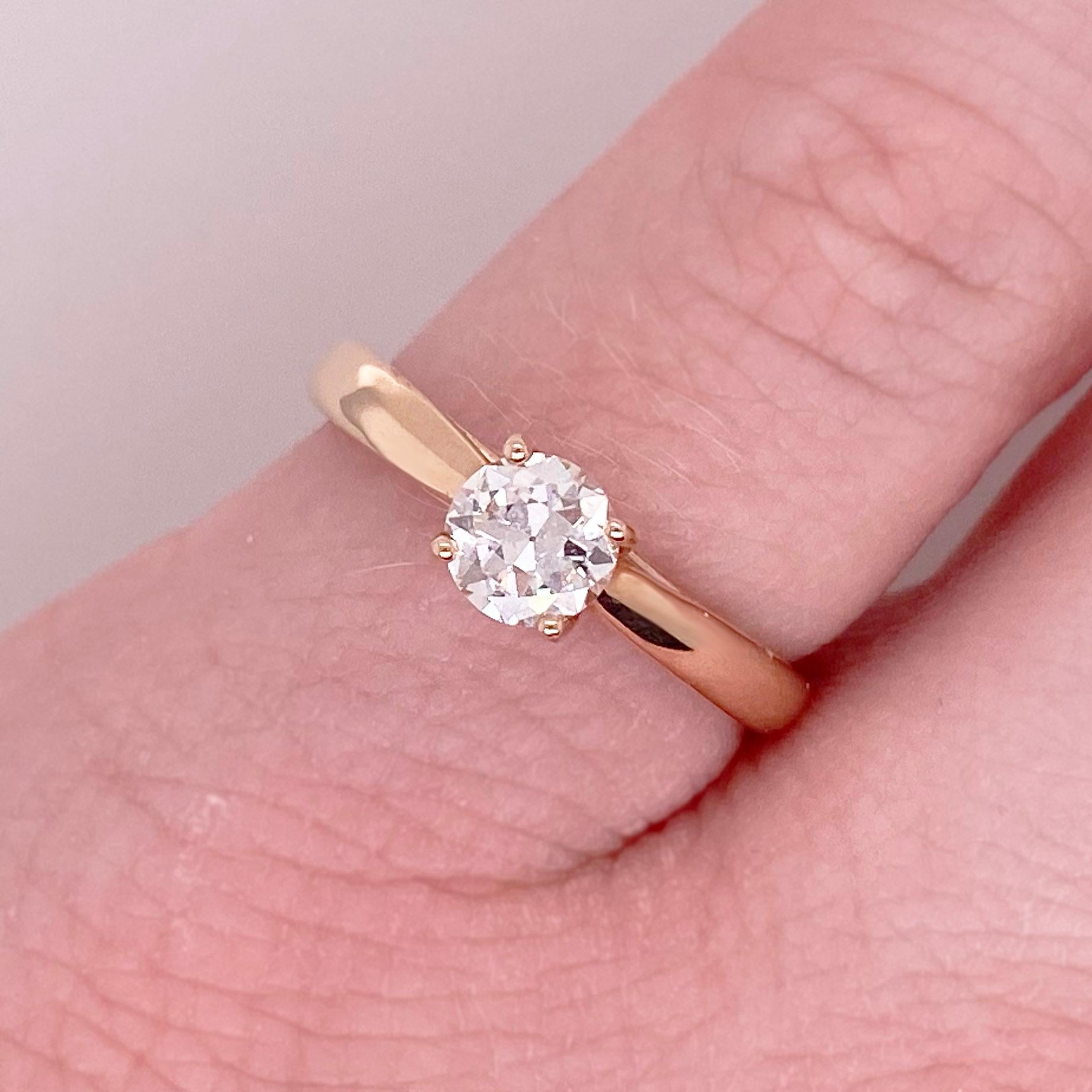 Gorgeous round old European cut diamond solitaire engagement ring! This gorgeous center diamond is set in four polished prongs. The 14 karat rose gold engagement ring is the perfect compliment to this stunning round diamond. Very stunning and