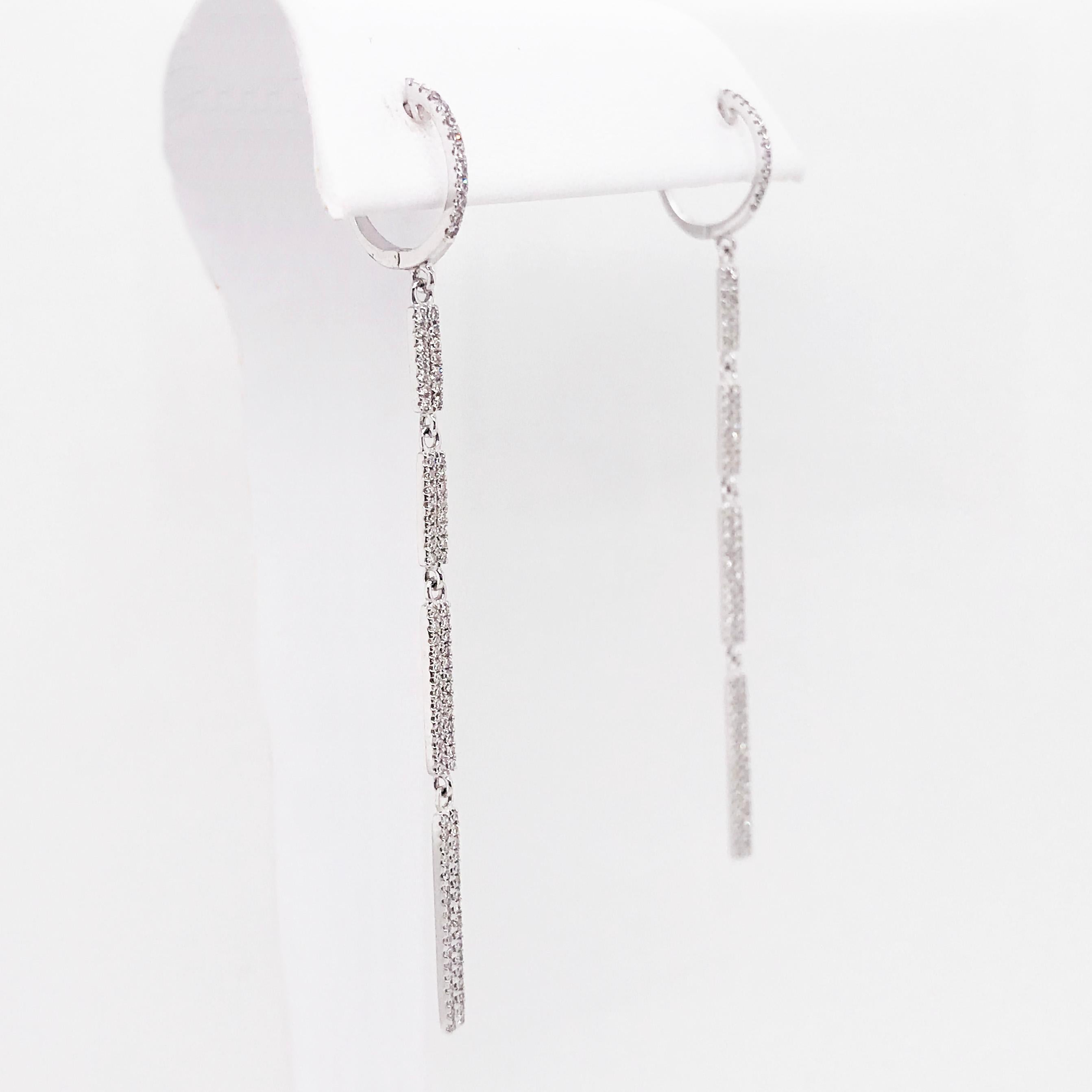 The diamond bar dangle earrings are modern and gorgeous. With four pave diamond bars linked together to created a dynamic movement that moves with you perfectly. Each bar has round brilliant diamonds pave set in two rows across the top. The earrings