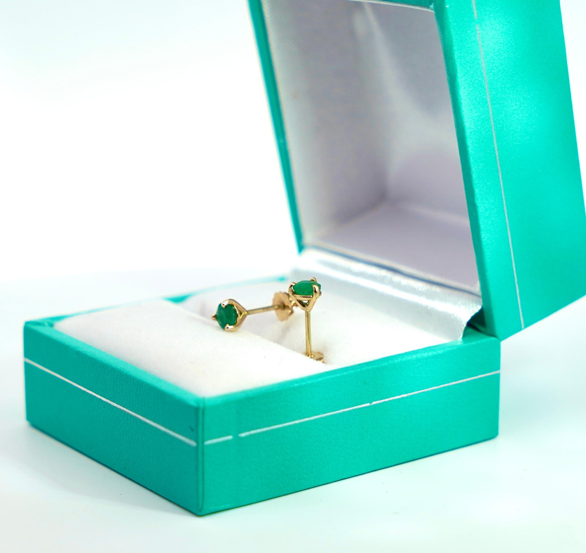 Natural emerald stud earrings in 14 karat solid gold. The real thing, for the best price.

Simple and elegant natural emerald martini stud earrings set in 14k solid gold for long-lasting and durable use. Push back or silicone closure with a