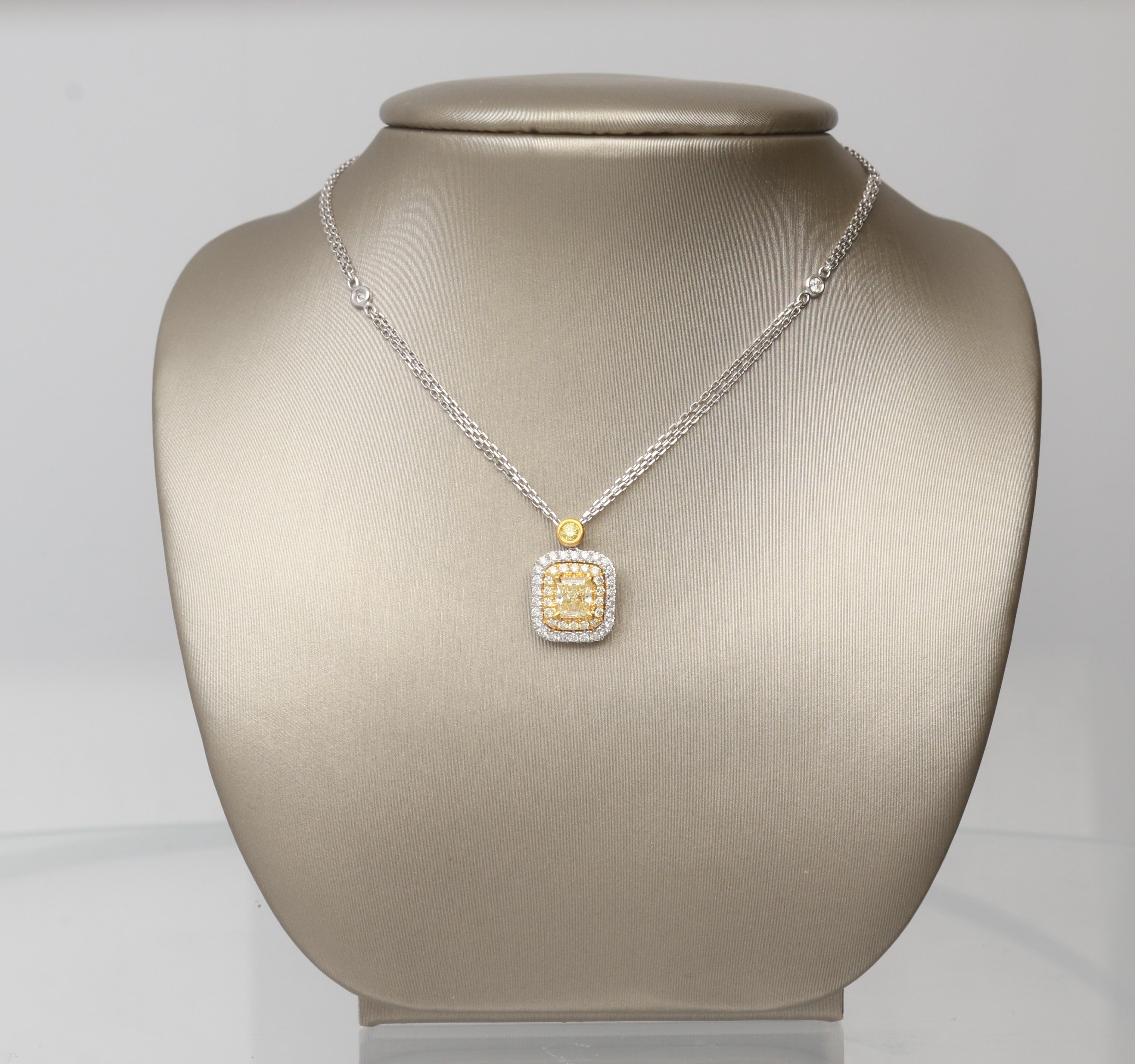 This beautiful Necklace is crafted in 18-karat Two Tone gold and features a cushion cut Yellow Diamond 1/2 Carat, surrounded by 17 Yellow Diamonds 0.14 Carat & 28 Round Diamonds 0.21 Carat with GH- SI quality.  
This Necklace comes with 16+2 inch