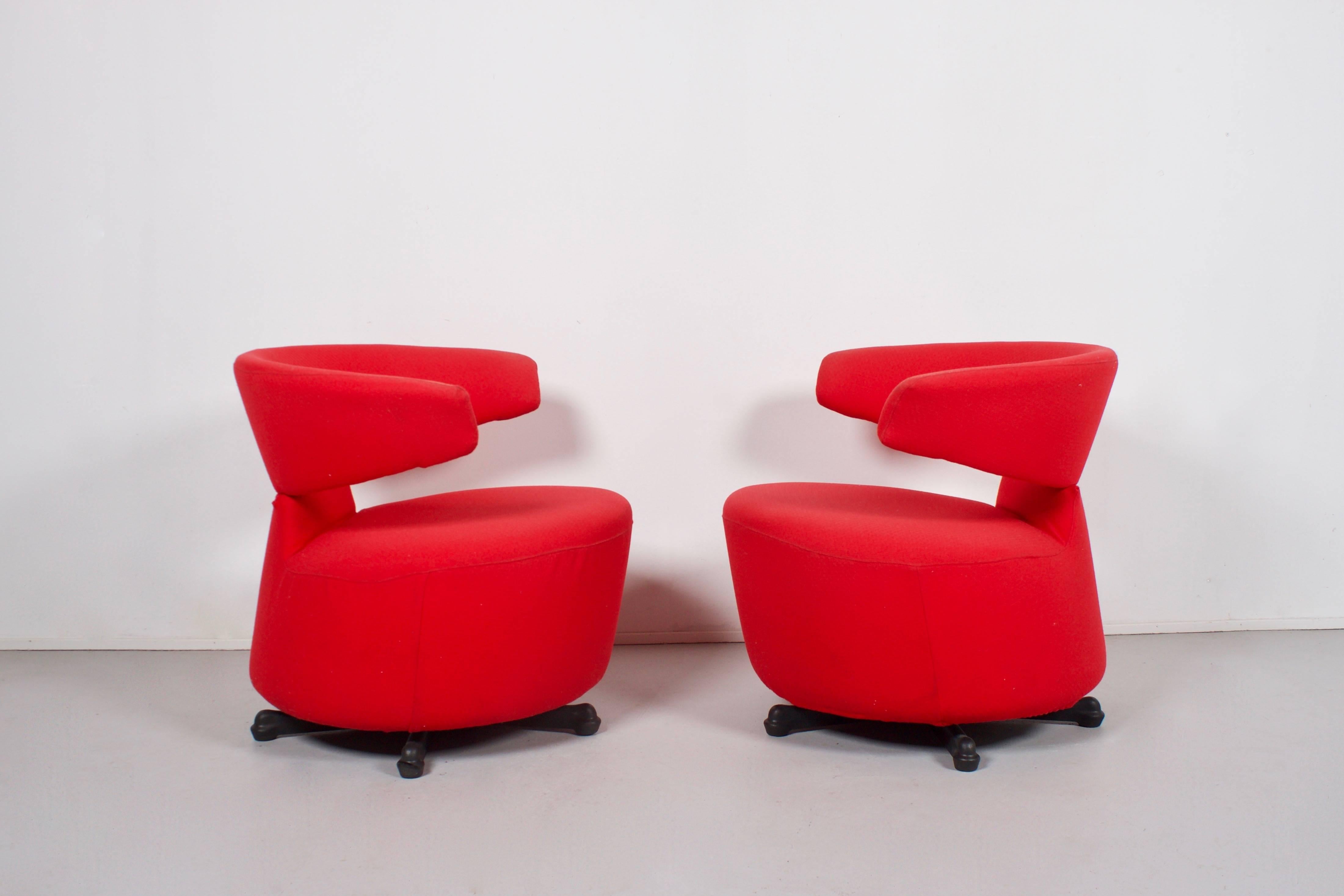 Swivel armchairs by Toshiyuki Kita by Cassina in good condition. 

Red removable fabric cover. 

Steel base with moulded black polyurethane casting. 

We offer a variety of insured shipping services, ask us for the possibilities and competitive