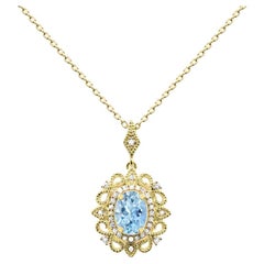 1/2 ct. Oval Aquamarine and Diamond Accent 14K Yellow Gold Pendant Necklace