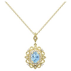 1/2 ct. Collier pendentif en or jaune 14K orné d'aigue-marine ovale et de diamants