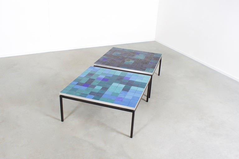 Impressive coffee tables by Berthold Müller in good condition. 

Manufactured by Mosaikwerkstatt Berthold Müller-Oerlinghaus.

The mosaic top of these tables is composed of tiles in various colors of blue.

They are beautiful match because they use