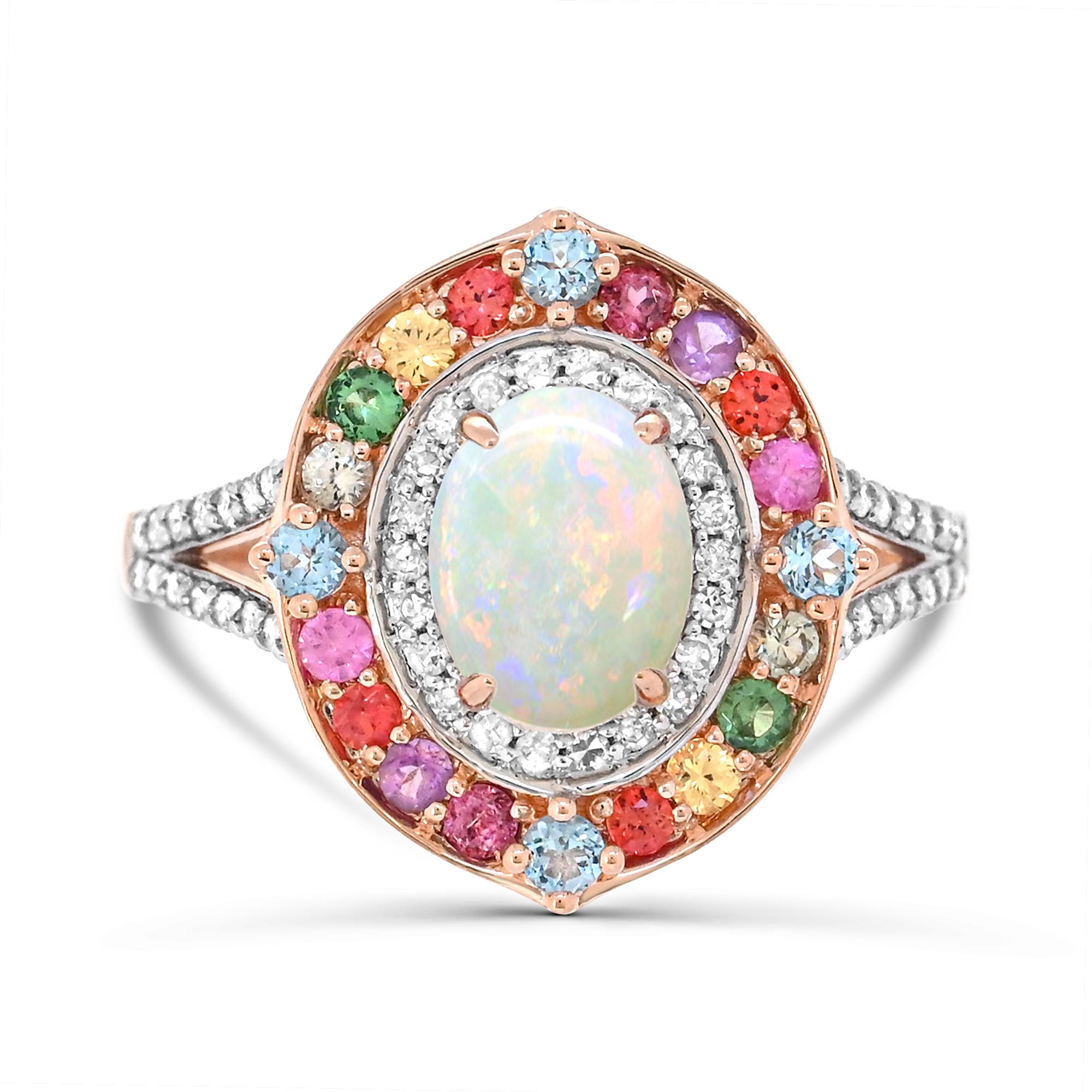 Indulge in the magnificence of our Oval-Cut Opal and Multi Gemstone Accent Ethiopian Style Cocktail Ring in 14K Rose Gold. Crafted with meticulous attention to detail, this ring boasts a stunning combination of one oval opal accented by sparkling