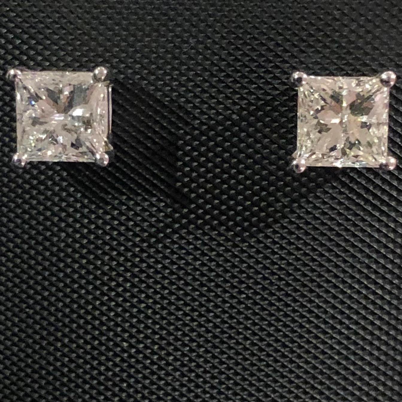 Stunning 1 3/5 Ct Princess Cut Solitaire Diamond Stud Earrings in 14K White Gold. These natural diamond solitaire studs are certified with an appraisal report value.

A large center solitaire diamond (size of an engagement ring) is set on each ear