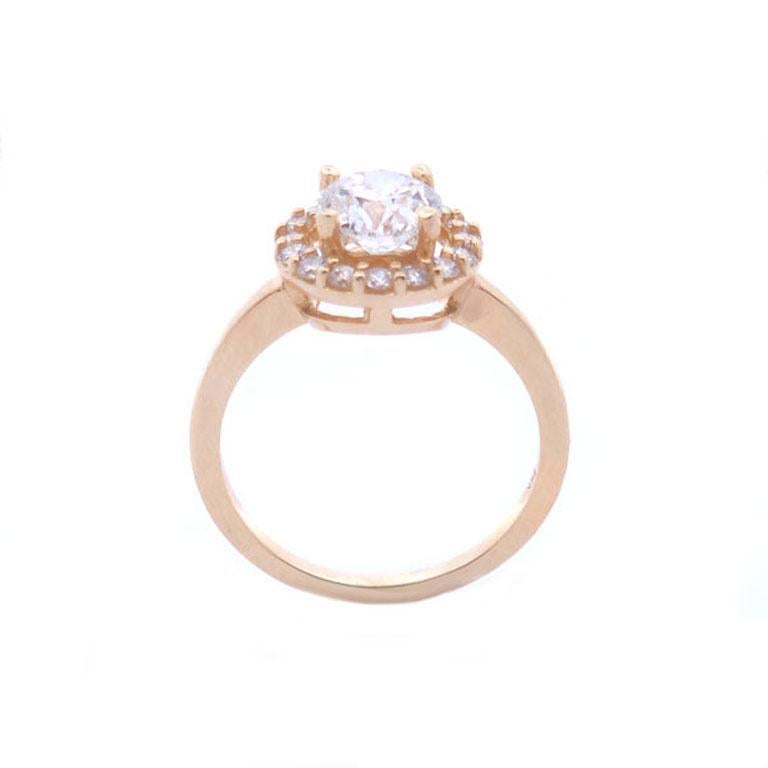 Celebrate your love with this breathtaking diamond halo ring, featuring a total diamond weight of 1 3/8 carats. At its heart is a brilliant round center diamond, surrounded by a radiant halo of smaller diamonds that amplify its sparkle and create a