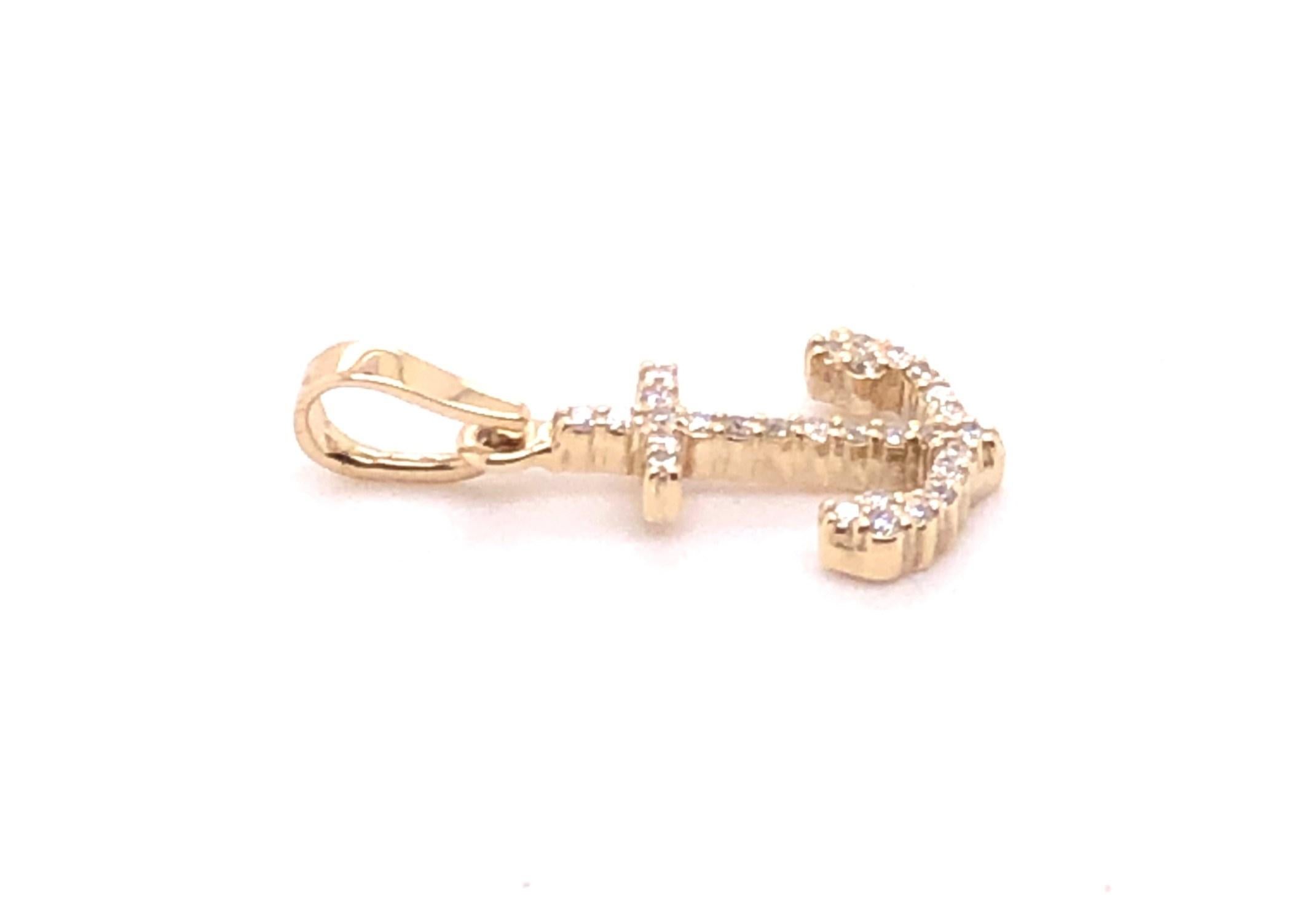 14kt yellow gold approximately .33 carats H-I/SI2-I1 Diamond Anchor Pendant. 

The anchor measures just under 1 inch high and .50inch at the widest point.