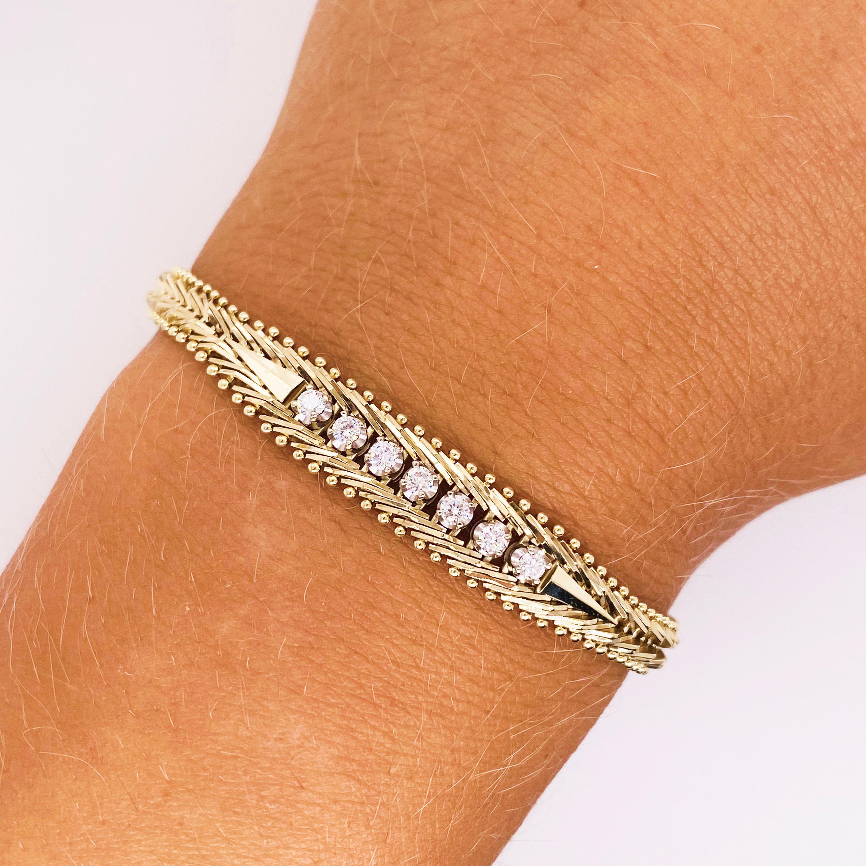 This 14 karat yellow gold and diamond bracelet has a lovely textured heavy design that is 7.25 inches long. The bracelet has seven round brilliant cut diamonds that are very lucky-seven is a lucky number!  The bracelet is 8 millimeters wide in the