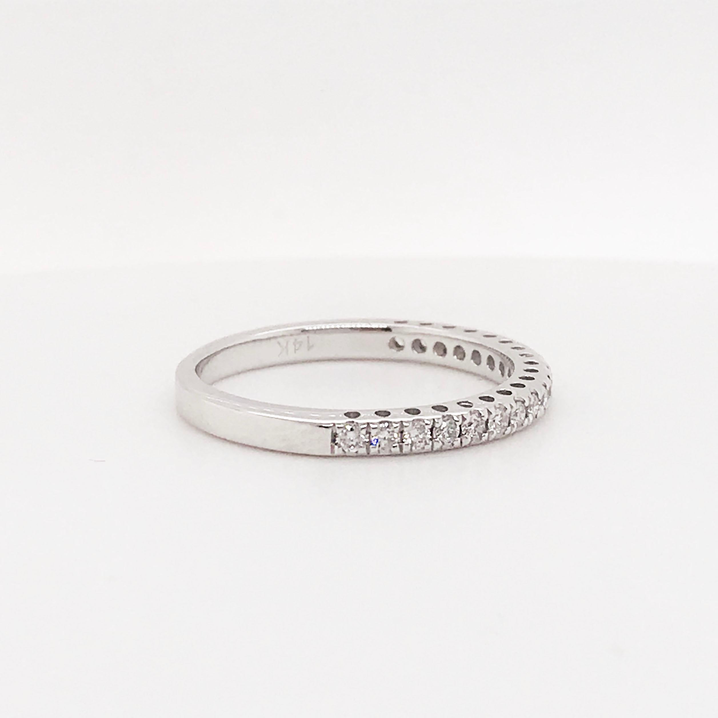 This amazing 14 kt gold band is our best selling diamond band!  It is a half eternity band features a row of diamonds that go half way around the band and there set with four prongs on each diamond.  The diamonds are set securely so that you don’t