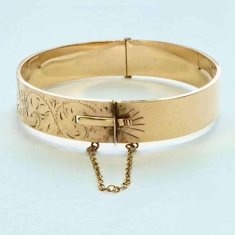 1/5th 9ct Rolled Gold Scroll and Leaf Engraved Bangle 1/5th 9ct Rolled Gold Scroll and Leaf Engraved Bangle