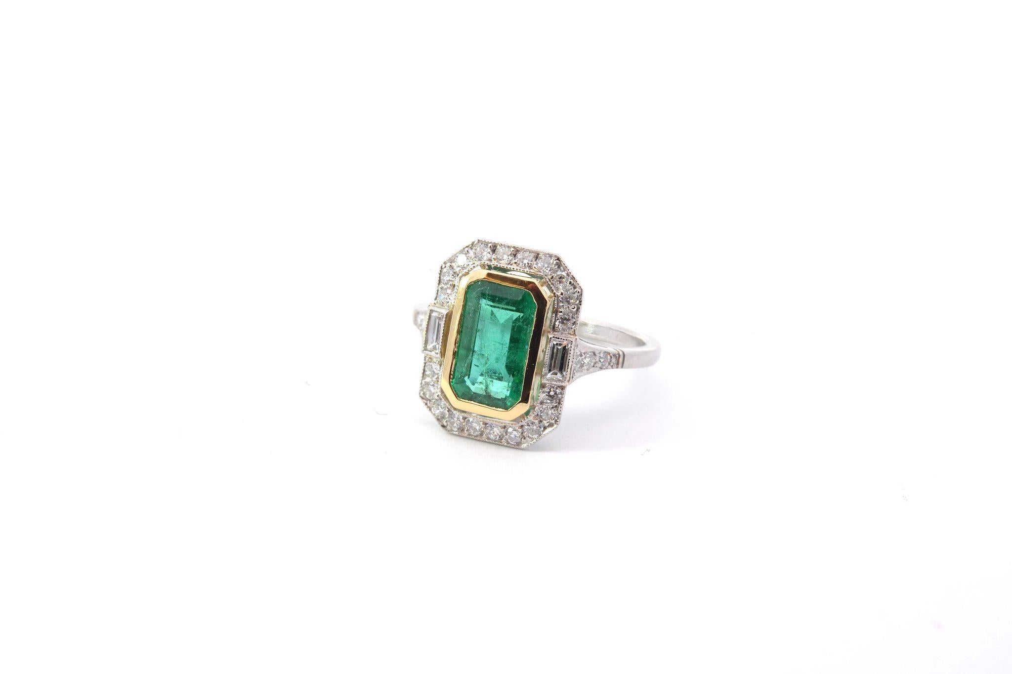 Emerald Cut 1, 79 carats emerald and diamonds ring in platinum and 18k gold For Sale