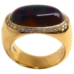 Ring aus Roségold mit 1 ovalem schwarzen Opal und 38 Diamanten 