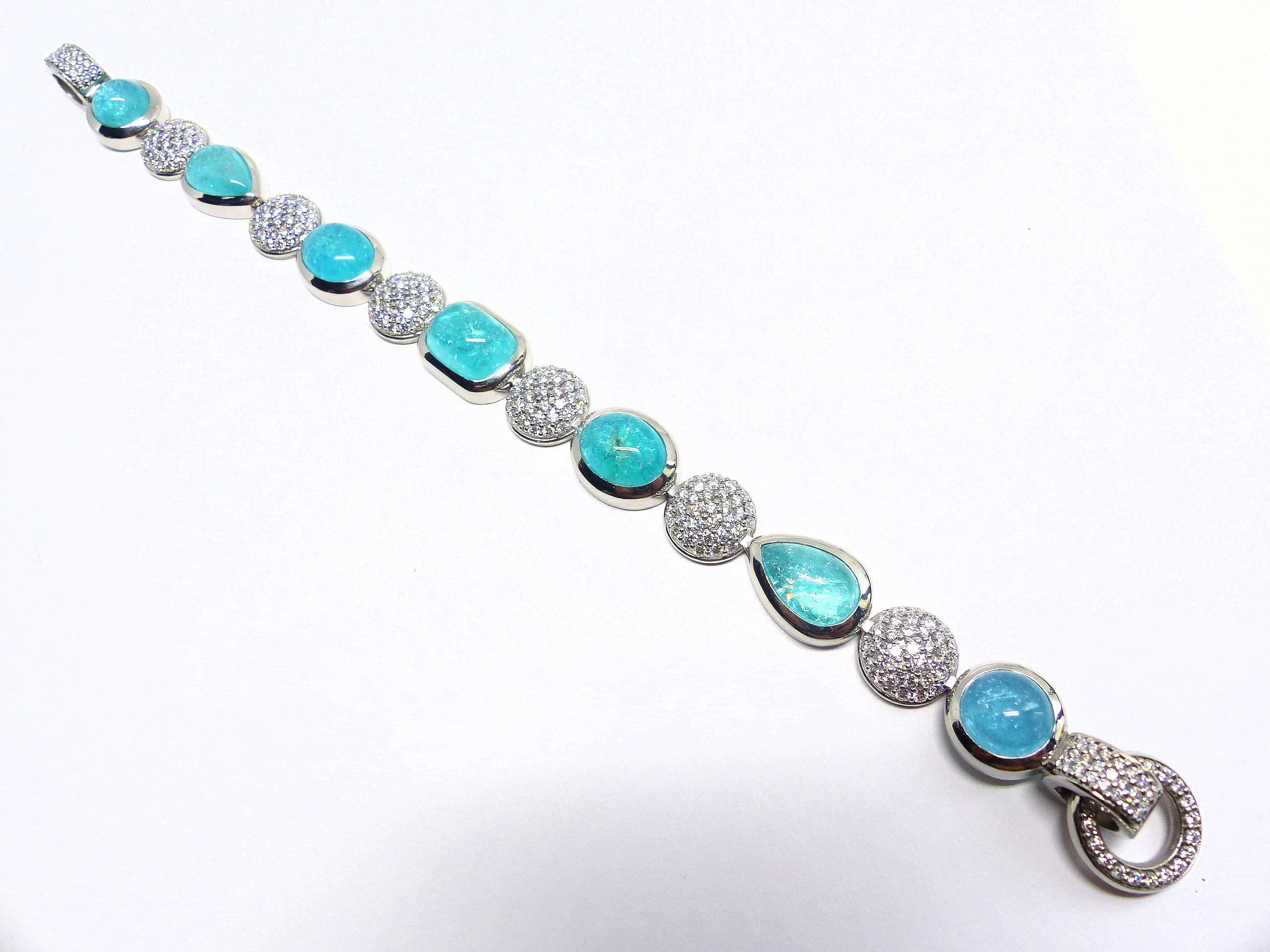 Thomas Leyser is renowned for his contemporary jewellery designs utilizing fine gemstones.

This braclet in 950/Platinum (61.2g) is set with 7x fine matching Paraiba Cabouchons (27.07ct), in magnificient intensiv blue/green (so called