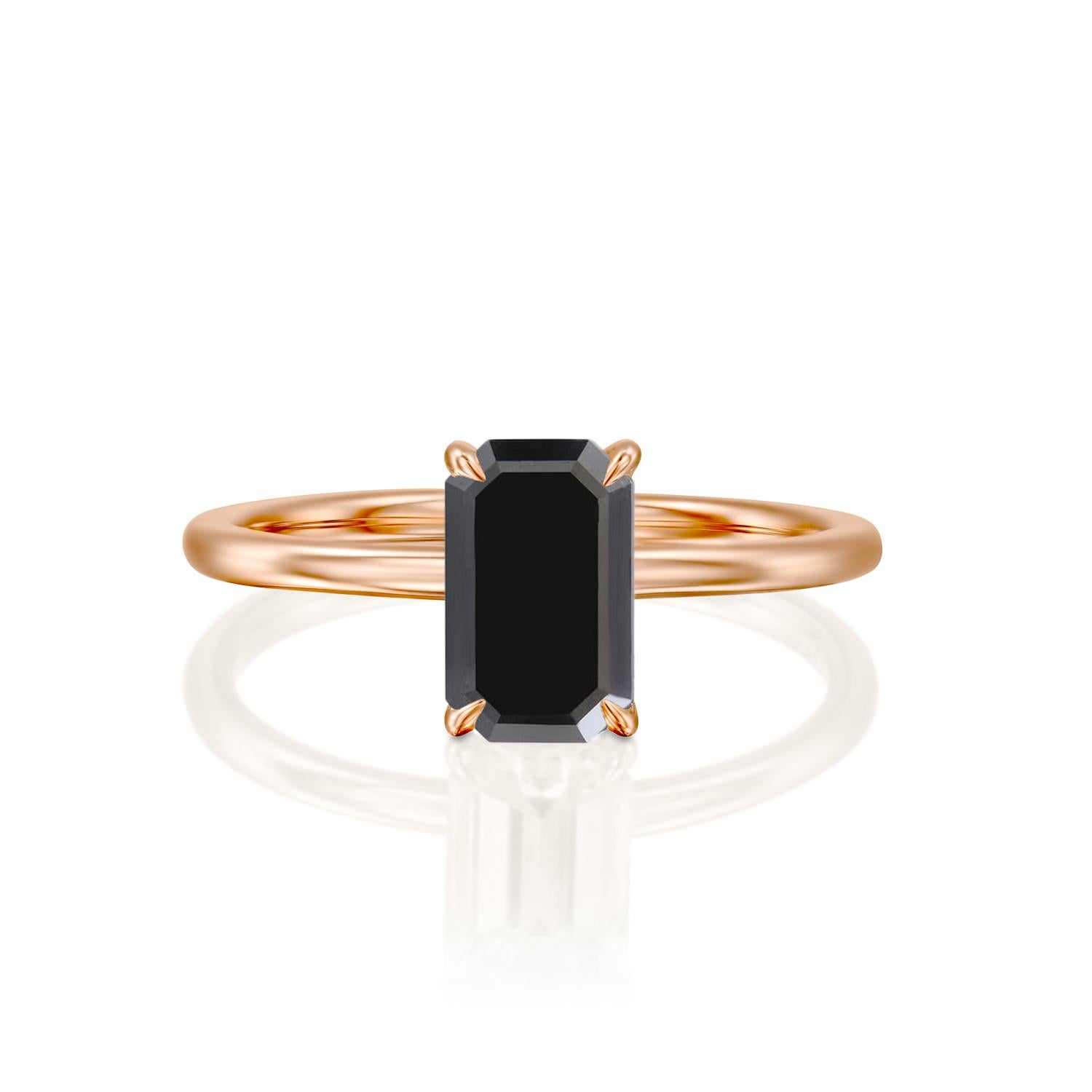 Beautiful minimalistic black diamond engagement ring ring. Center stone is of 1 carat, natural, emerald shaped, AAA quality Black diamond. Set in a sleek, 14K rose gold, solitaire ring with a 4-prong setting. The setting looks delicate but is