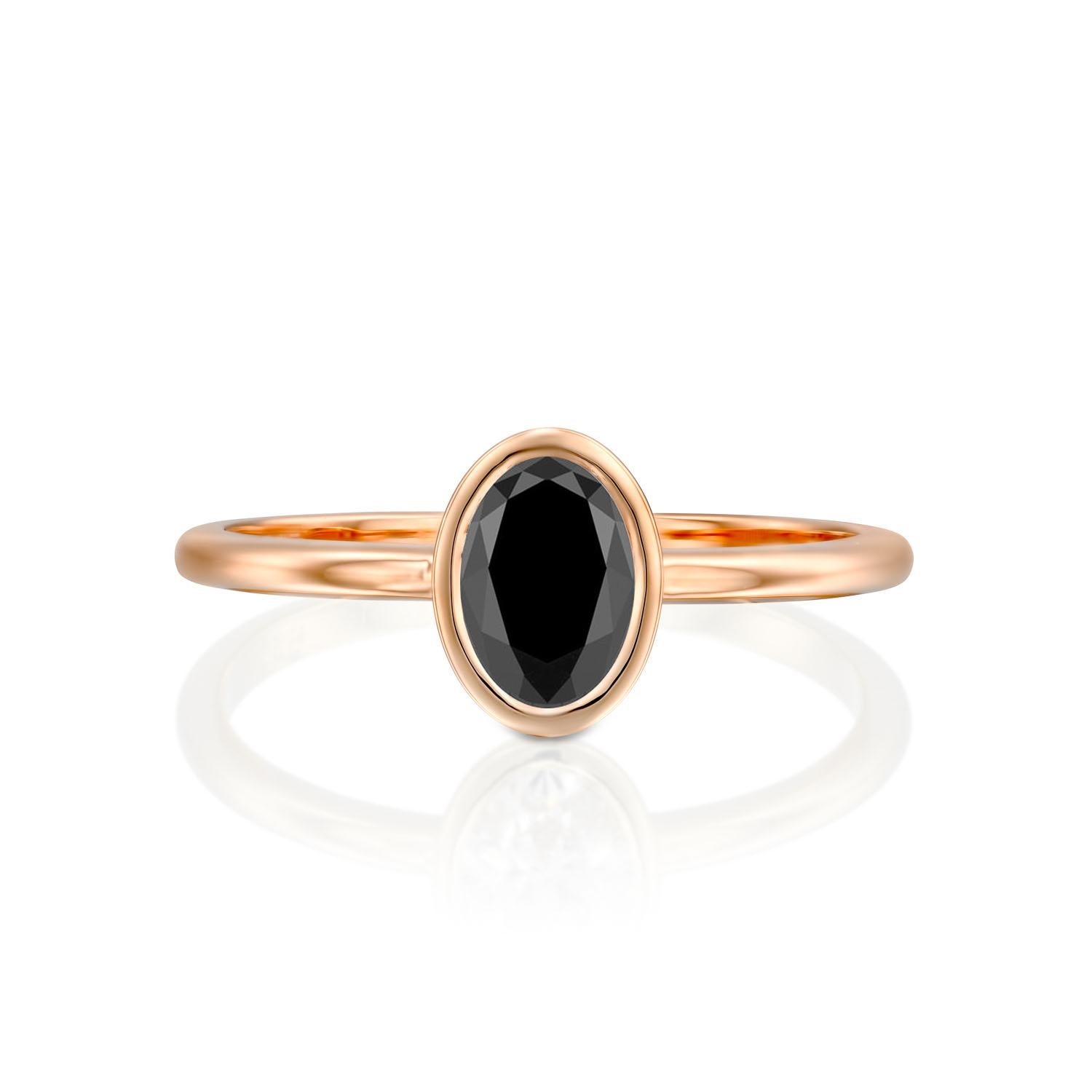 Beautiful minimalistic style black diamond engagement ring ring. Center stone is of 1 carat, natural, oval shaped, AAA quality Black diamond. Set in a sleek, 14K rose gold, solitaire ring with a bezel setting. The setting looks delicate but is