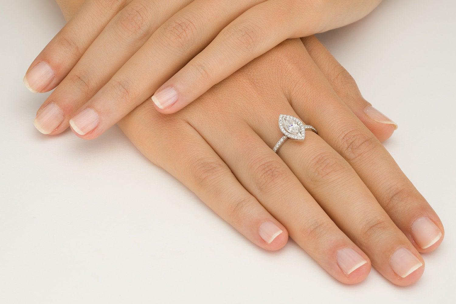 1 carat marquise diamond ring on finger