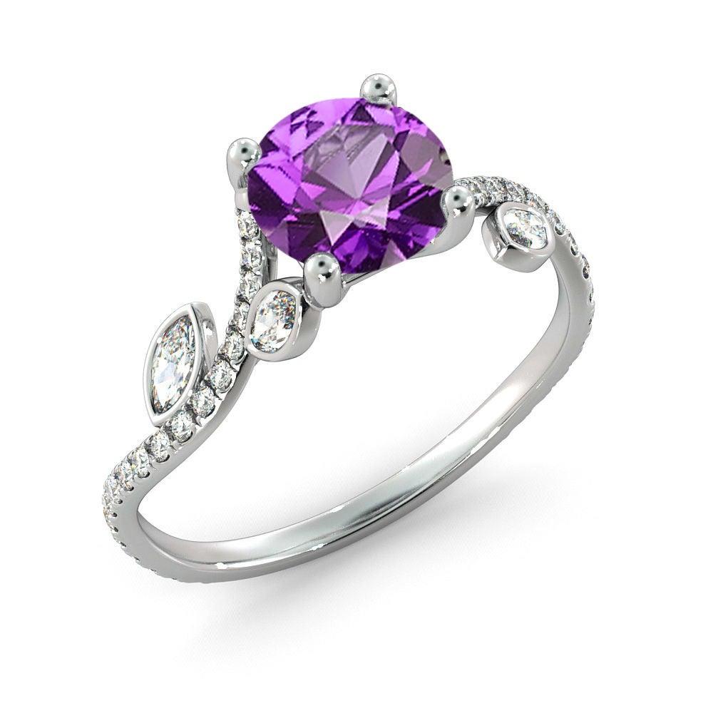 A beautiful handmade engagement ring made of 14K white gold set with a purple, round Amethyst of 1 carat.
 
 Amethyst Details:
 Main Stone: Amethyst 
 Main Stone Weight: 1.00 ct/5mm
  Color: Purple
  Clarity: VS (natural) 
  Cut: Excellent