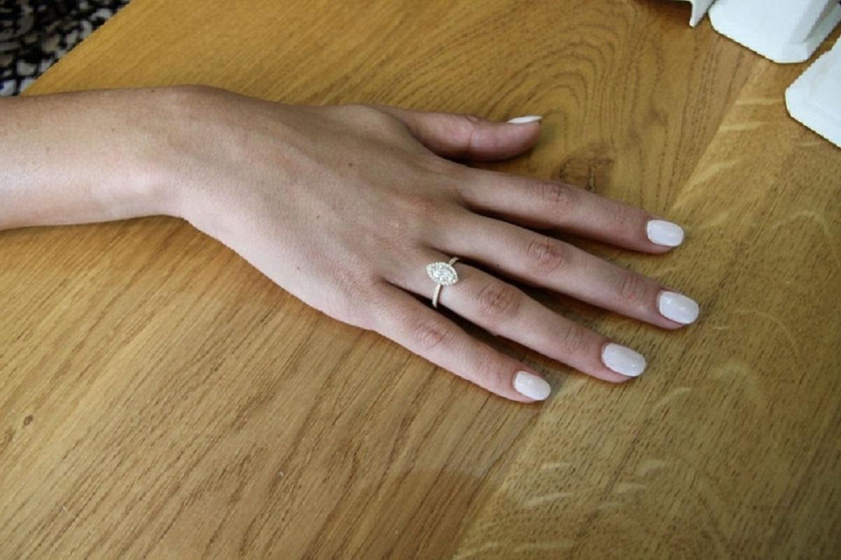 1 carat marquise diamond ring on finger