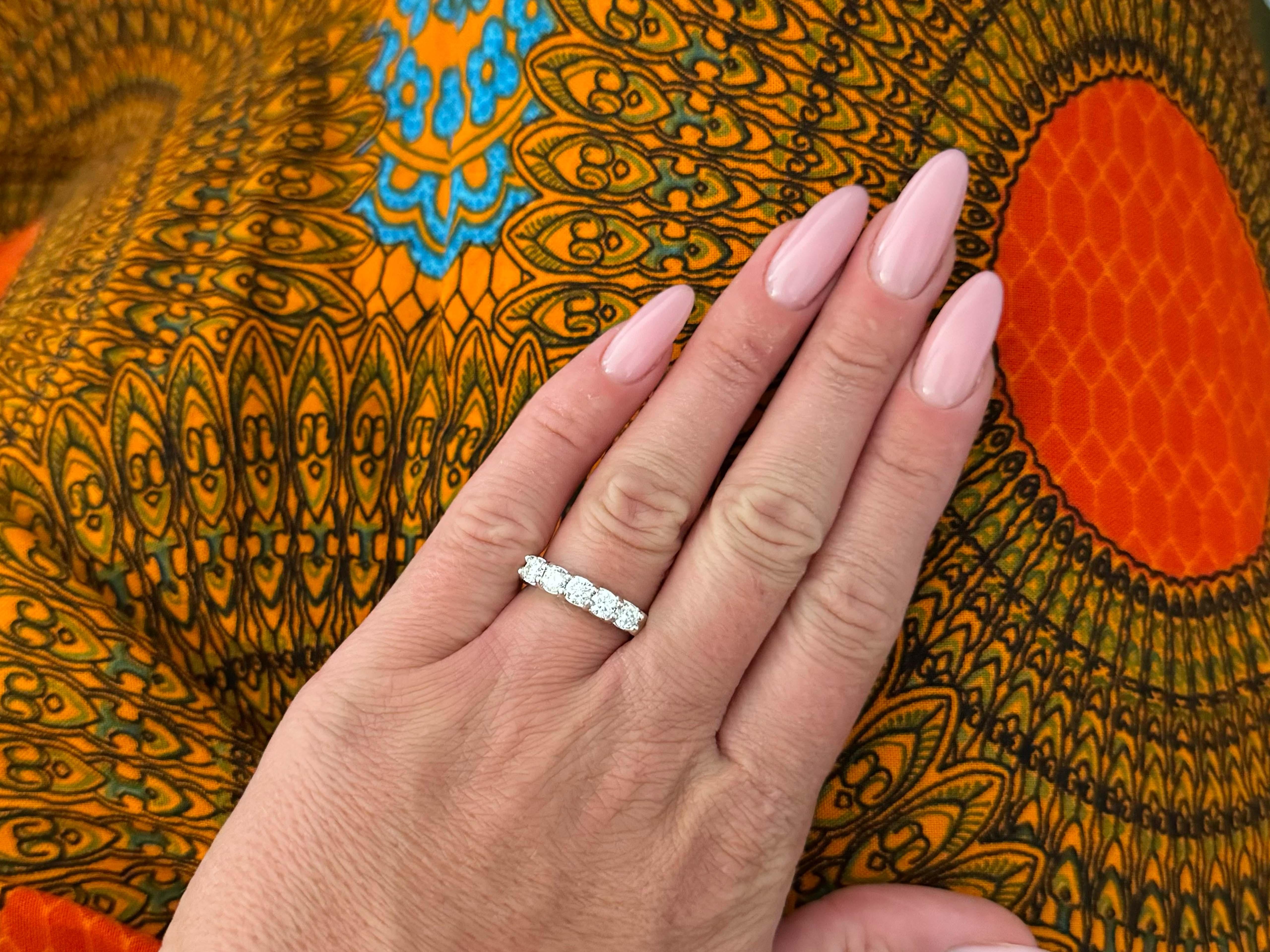 Item Specifications:

Metal: 14k White Gold

Diamond Count: 5 brilliant cut

Total Diamond Carat Weight: ~1.00 carats 

Diamond Color: G

Diamond Clarity: SI2

Ring Size: 5.75

Total Weight: 6.5 Grams

Stamped: 