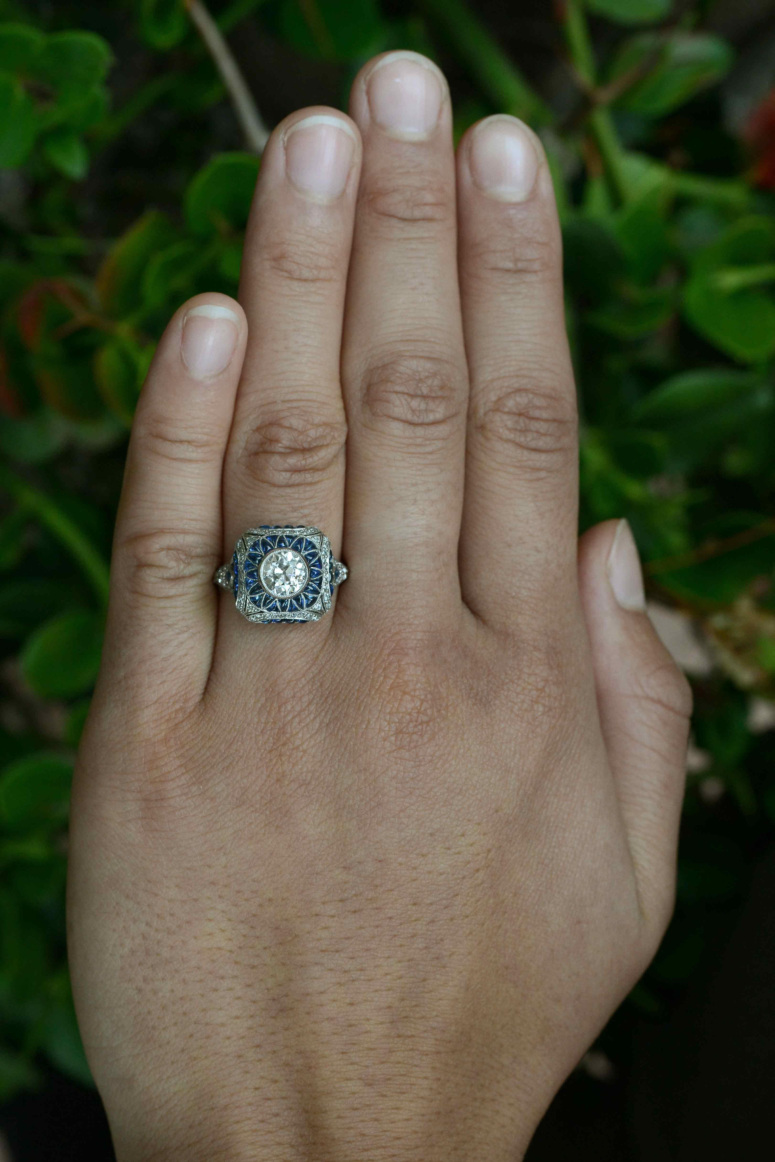 An antique old mine diamond engagement ring that's Art Deco inspired, with a micro mosaic sapphire dome that is most mesmerizing and so detailed. With large, chunky facets, this over 1 carat, 120 year old hand cut diamond displays a captivating,