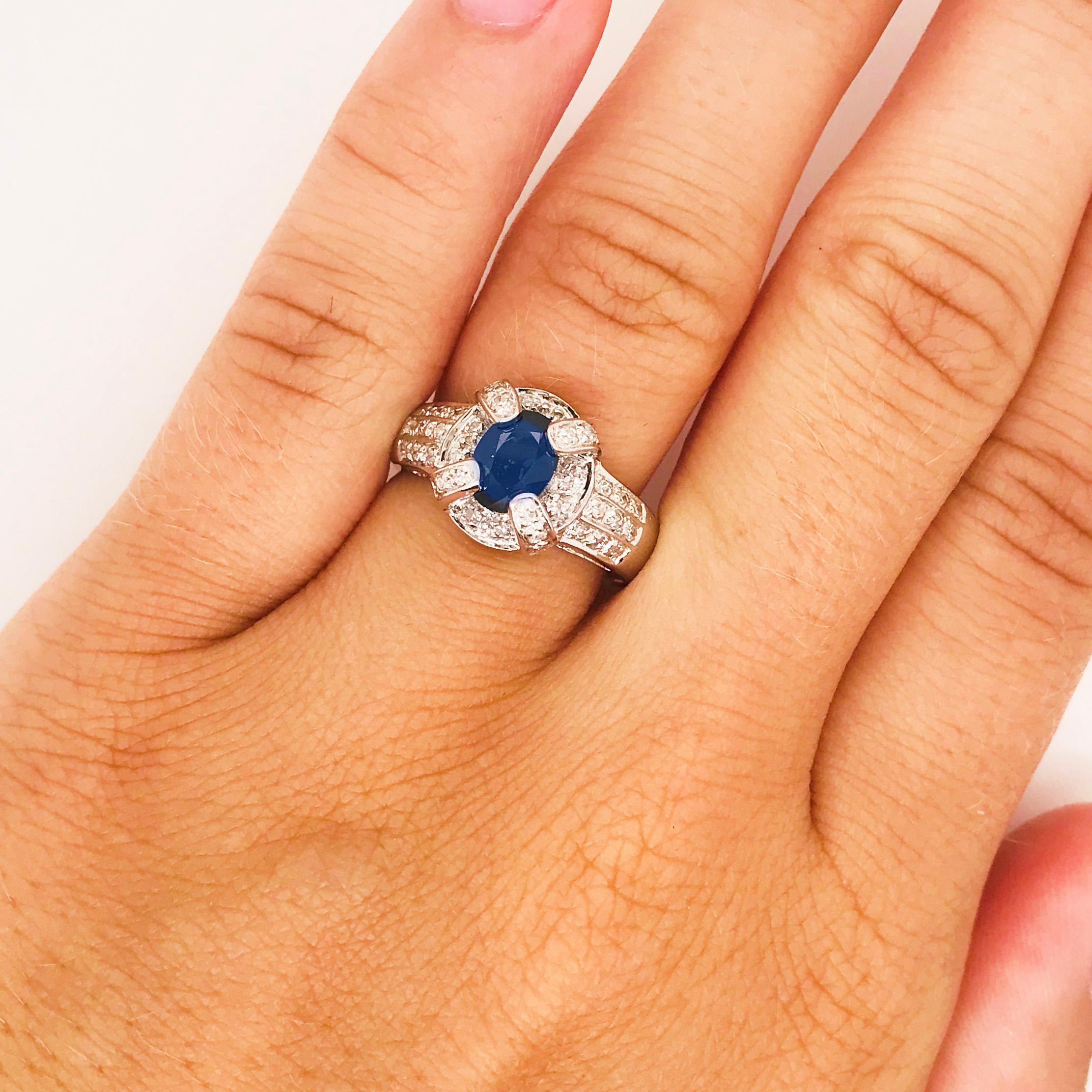 The stunning blue sapphire and diamond engagement ring is a classic and timeless fine jewelry piece. The enter is a genuine blue sapphire gemstone that has been cut and polished into a perfectly symmetrical faceted oval shape. The oval shape is