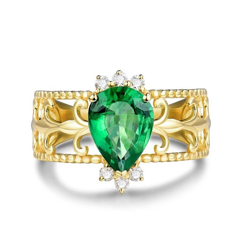 
1 Carat Columbian Emerald ring with 6 diamonds set in 14 Karat Yellow Gold and is in this unique design. 

  Colombian emeralds are known for the highest quality. These emeralds have a warmer and intense pure green color. Emeralds from Colombian