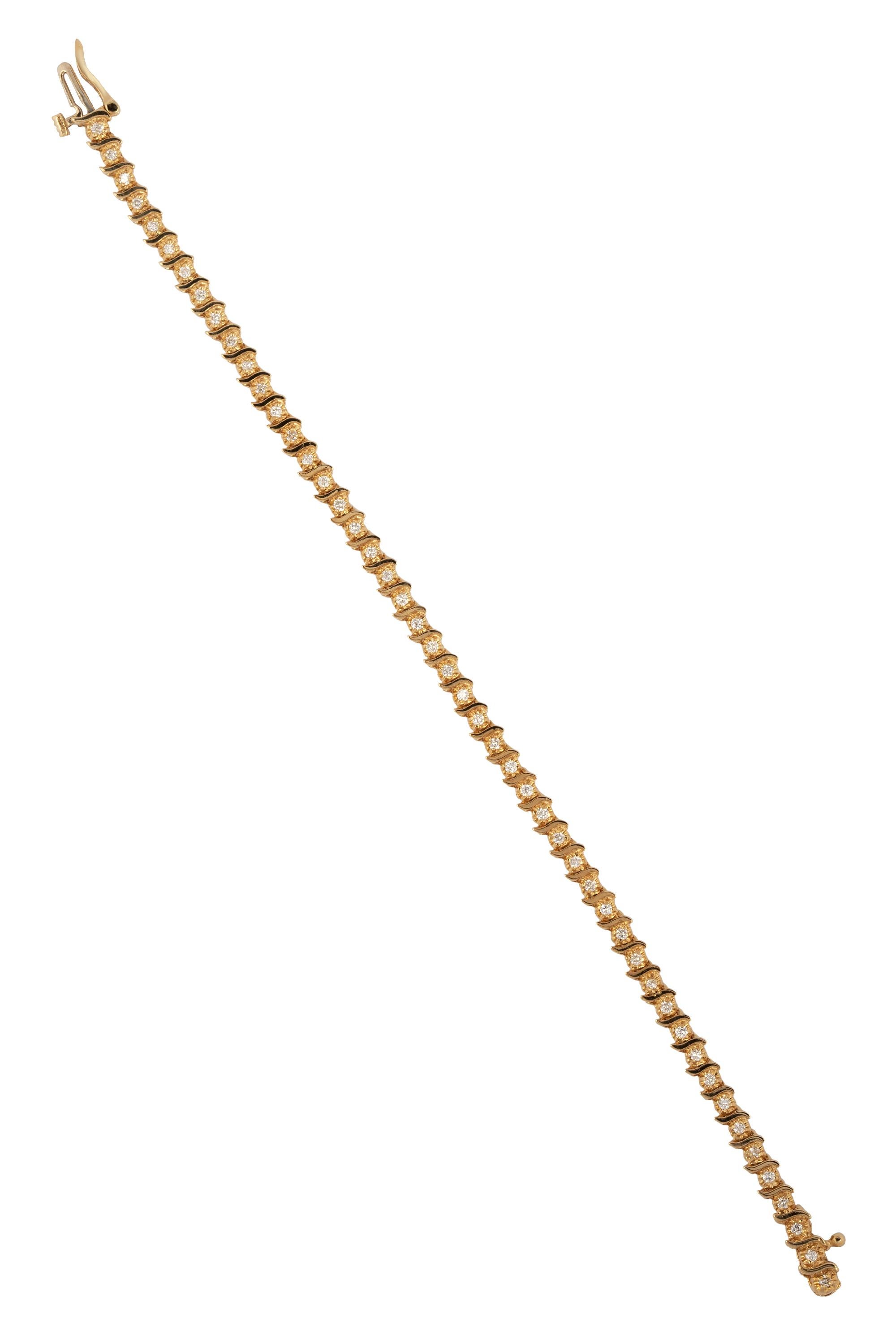 This sparkling diamond tennis bracelet in 14K yellow gold exudes timeless elegance and sophistication. Featuring 49 round brilliant-cut diamonds, with a total weight of approximately 1.47 carat, the bracelet dazzles with G-H color and VS clarity.