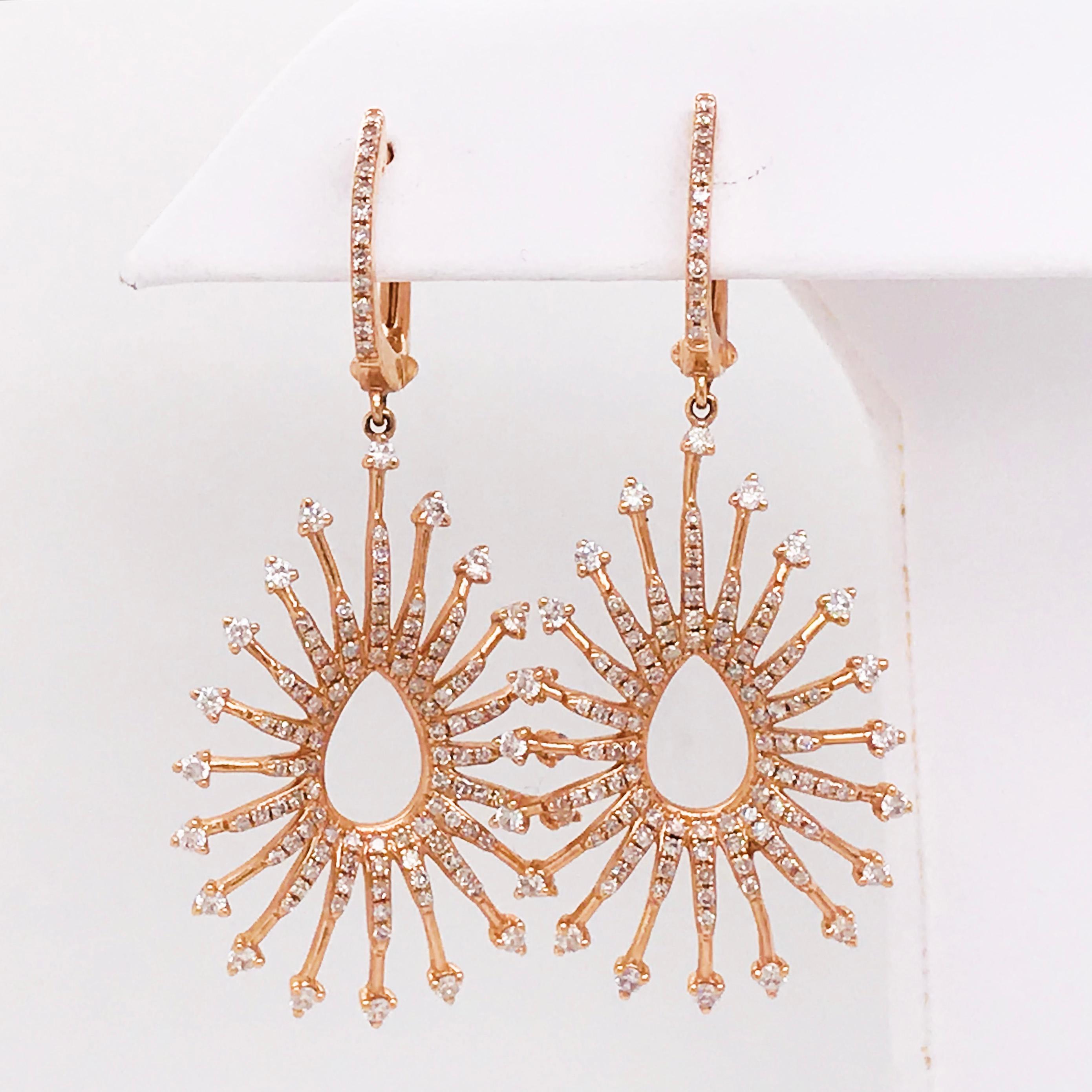 These are one of a kind rose gold dangle earrings with diamonds, perfect for a wedding or any event where you want to feel fabulous! A gorgeous pear shaped starburst is paved with round brilliant diamonds. The unique prong setting gives each of the