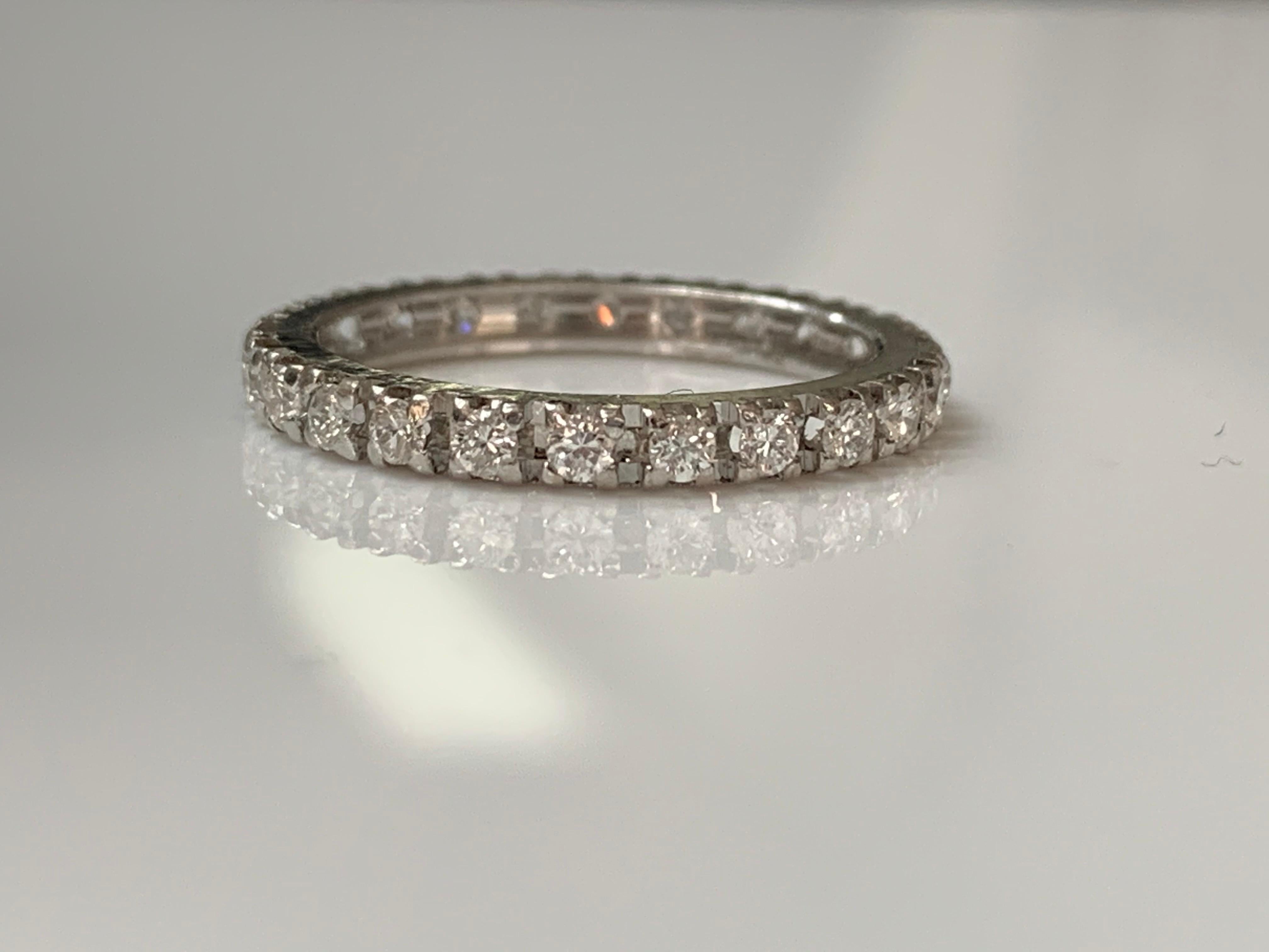 This beautiful diamond eternity band is hand crafted in 14 k white gold. 
The details are as follows : 
Diamond weight : 1 carat 
Metal : 14 K White Gold 
Ring Size : 6 3/4 
