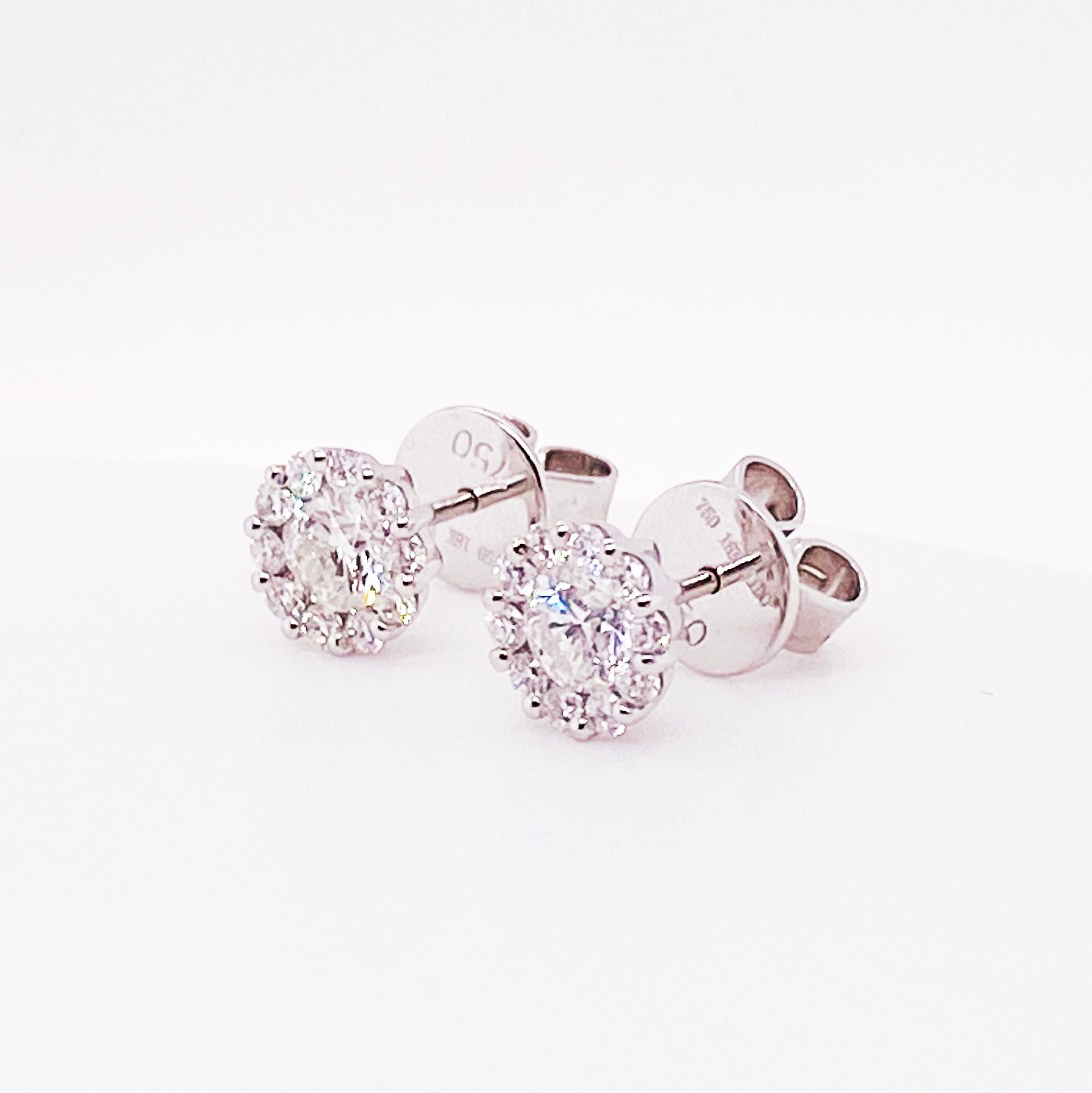 The adorable diamond studs are designed with genuine, natural diamonds and precious metal, 18k gold. The diamond earrings have a round brilliant diamond set in a round brilliant diamond halo frame. The diamonds are set securely and close together